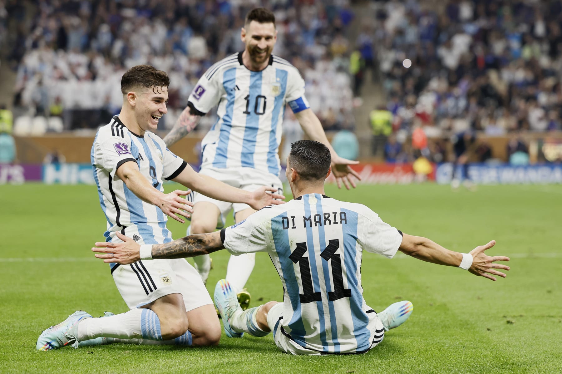 LUSAIL CITY, QATAR - DECEMBER 18: Julian Alvarez, Lionel Messi and Angel Di Maria of Argentina celebrate 2nd goal during the FIFA World Cup Qatar 2022 Final match between Argentina and France at Lusail Stadium on December 18, 2022 in Lusail City, Qatar. (Photo by Richard Sellers/Getty Images)