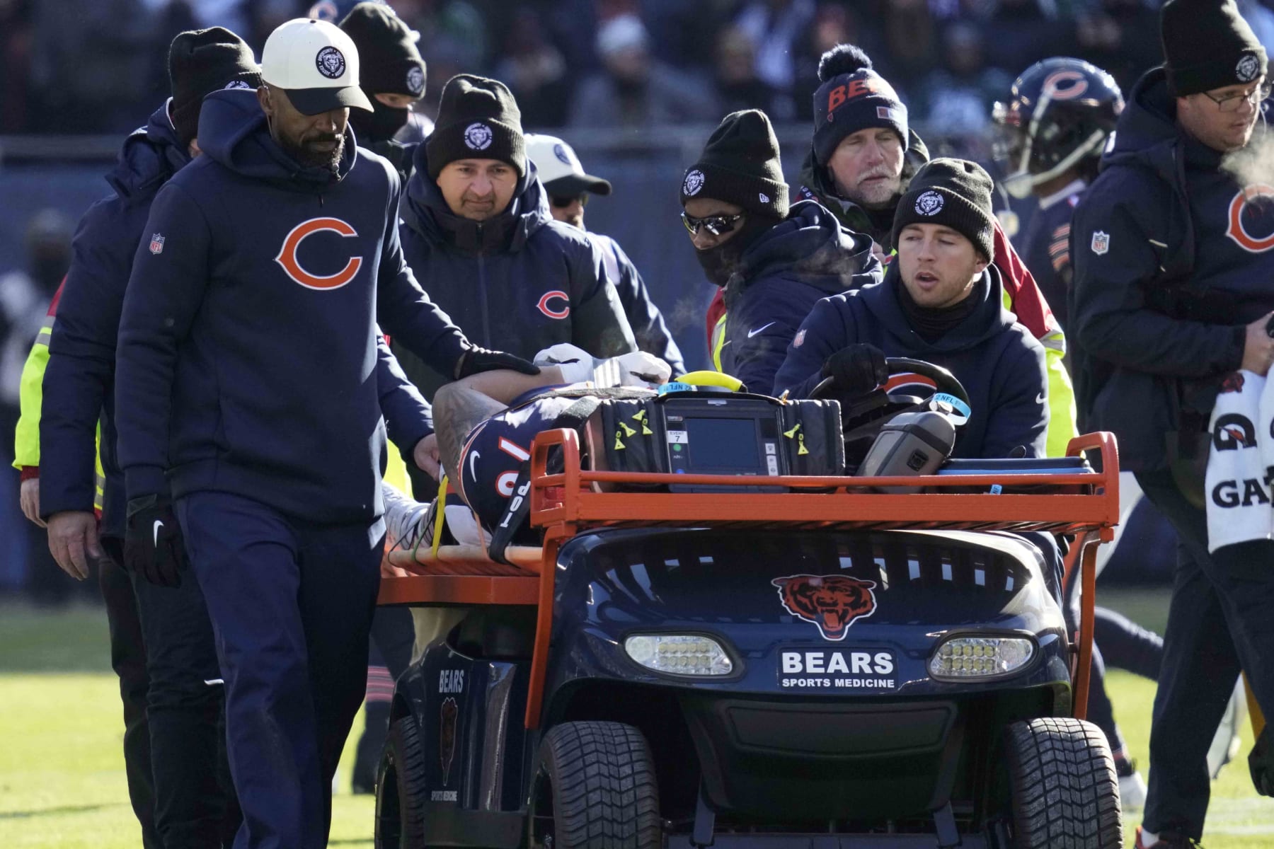 Chicago Bears' Teven Jenkins is carted off the field after an injury during the first half of an NFL football game against the Philadelphia Eagles, Sunday, Dec. 18, 2022, in Chicago. (AP Photo/Nam Y. Huh)