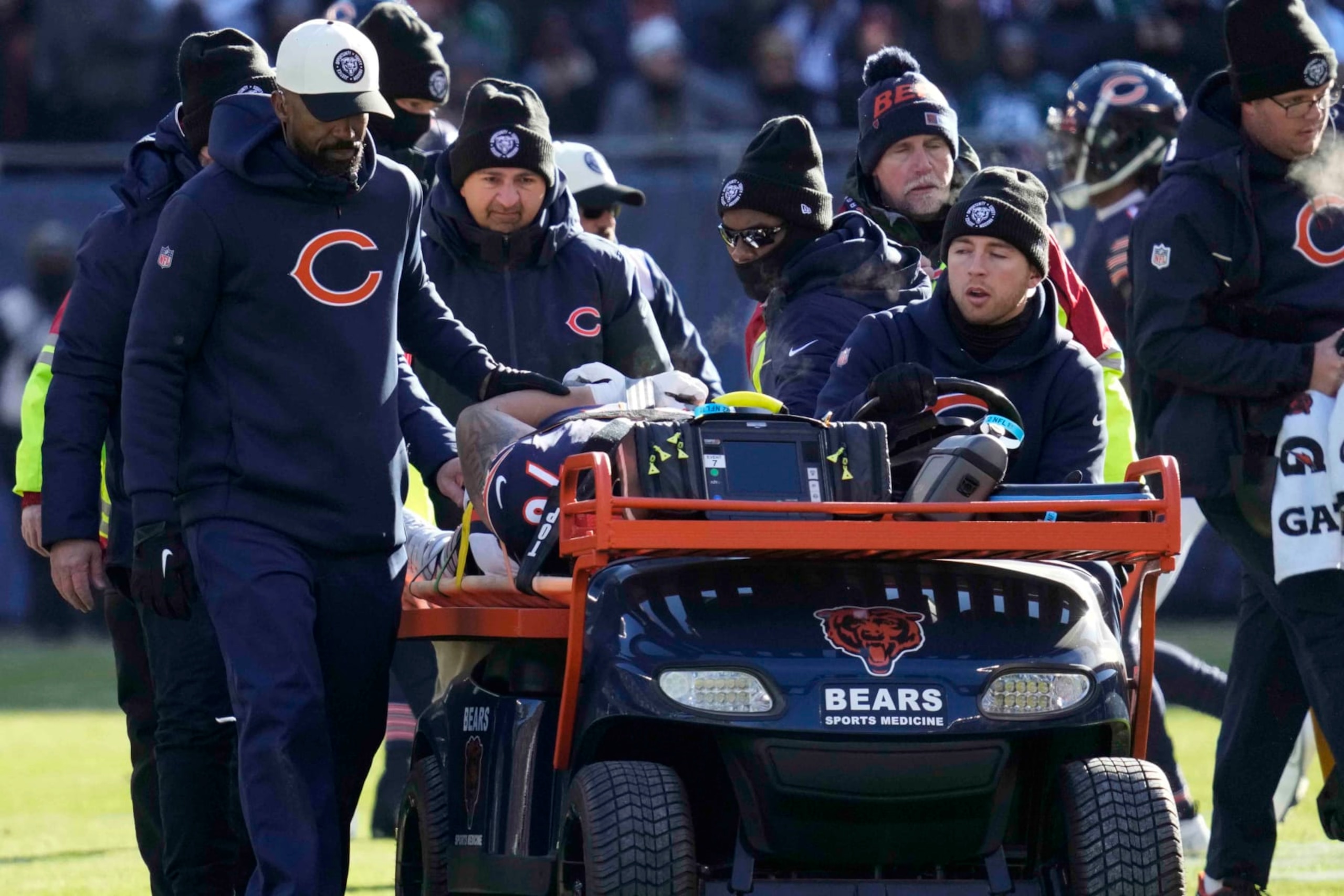 Chicago Bears' Teven Jenkins is carted off the field after an injury during the first half of an NFL football game against the Philadelphia Eagles, Sunday, Dec. 18, 2022, in Chicago. (AP Photo/Nam Y. Huh)