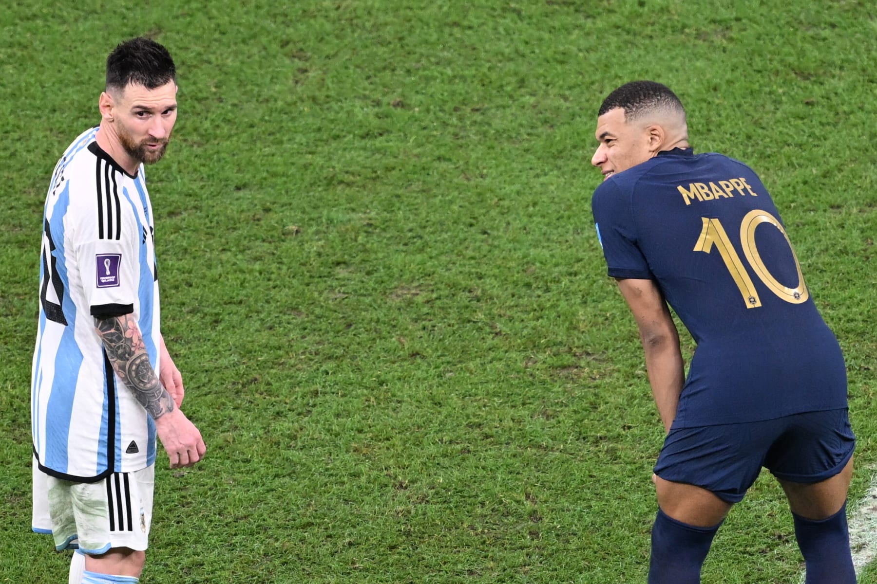 LUSAIL CITY, QATAR - DECEMBER 18: Lionel Messi (10) of Argentina and Kylian Mbappe (10) of France wait for the extra time to start during the FIFA World Cup Qatar 2022 Final match between Argentina and France at Lusail Stadium on December 18, 2022 in Lusail City, Qatar. (Photo by Ercin Erturk/Anadolu Agency via Getty Images)