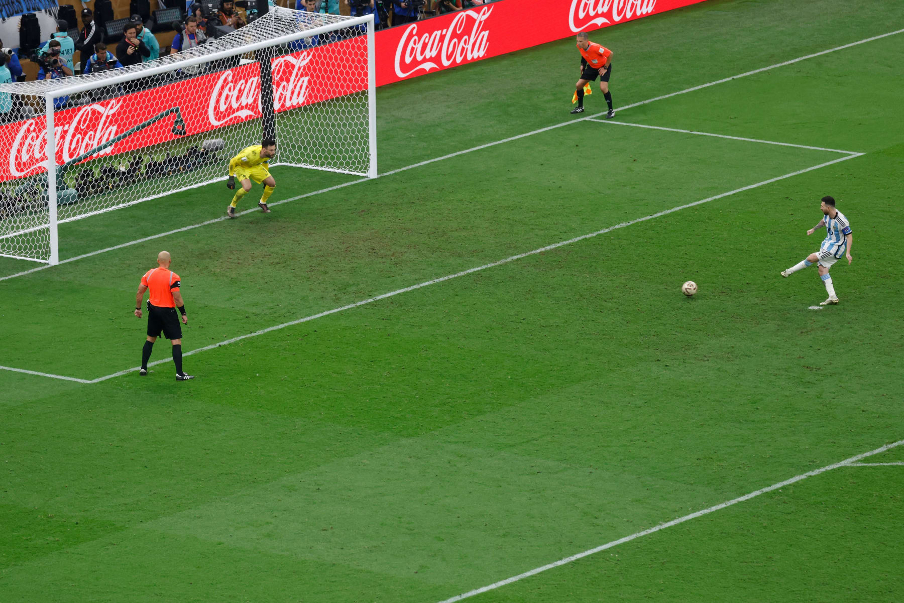 Argentina's forward #10 Lionel Messi takes the first penalty of his team to score past France's goalkeeper #01 Hugo Lloris during the penalty shoot-out of the Qatar 2022 World Cup football final match between Argentina and France at Lusail Stadium in Lusail, north of Doha on December 18, 2022. (Photo by Odd ANDERSEN / AFP) (Photo by ODD ANDERSEN/AFP via Getty Images)