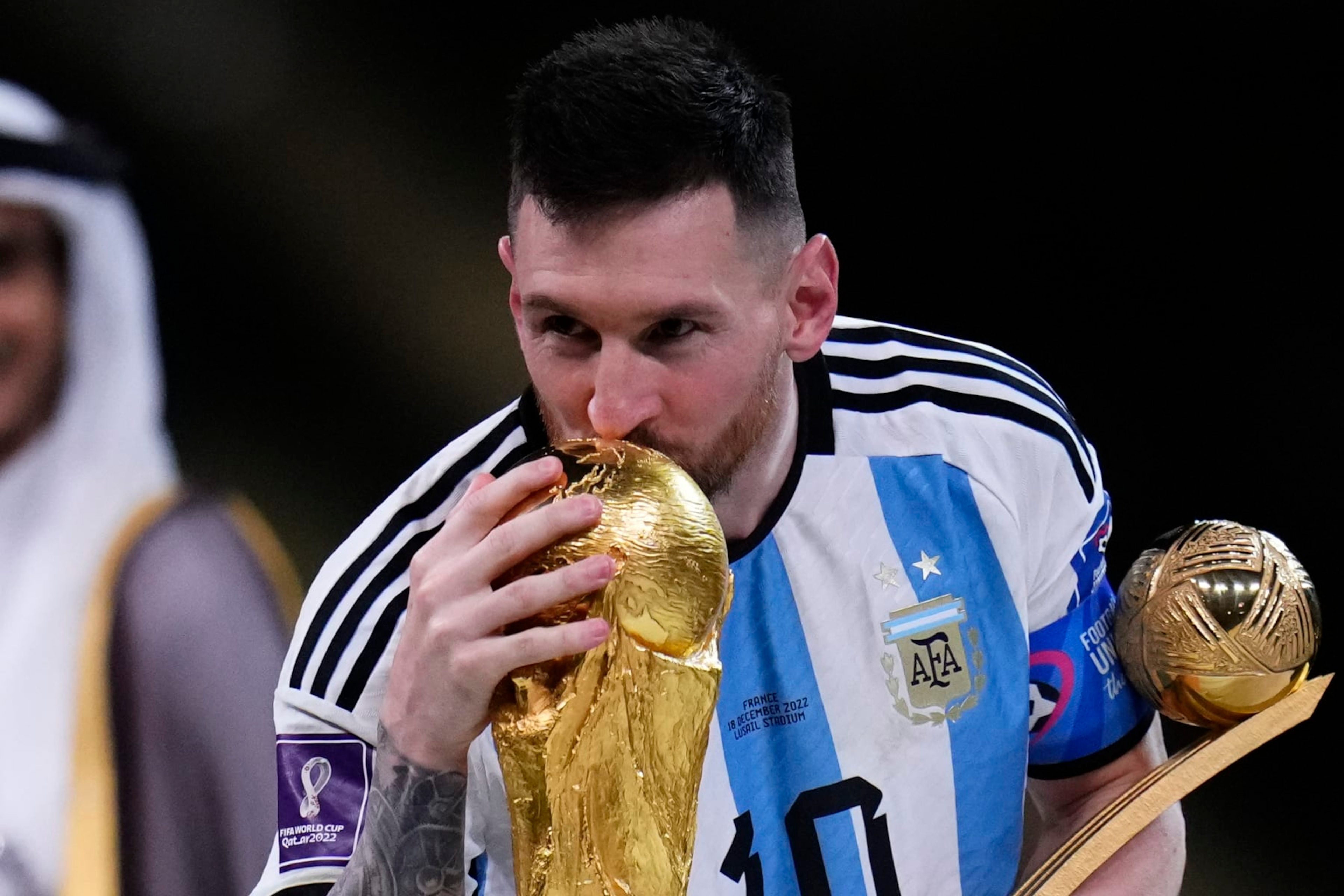 Argentina's Lionel Messi kisses the trophy after winning the World Cup final soccer match between Argentina and France at the Lusail Stadium in Lusail, Qatar, Sunday, Dec.18, 2022. (AP Photo/Manu Fernandez) Argentina's Lionel Messi kisses the trophy after winning the World Cup final soccer match between Argentina and France at the Lusail Stadium in Lusail, Qatar, Sunday, Dec.18, 2022. (AP Photo/Manu Fernandez)