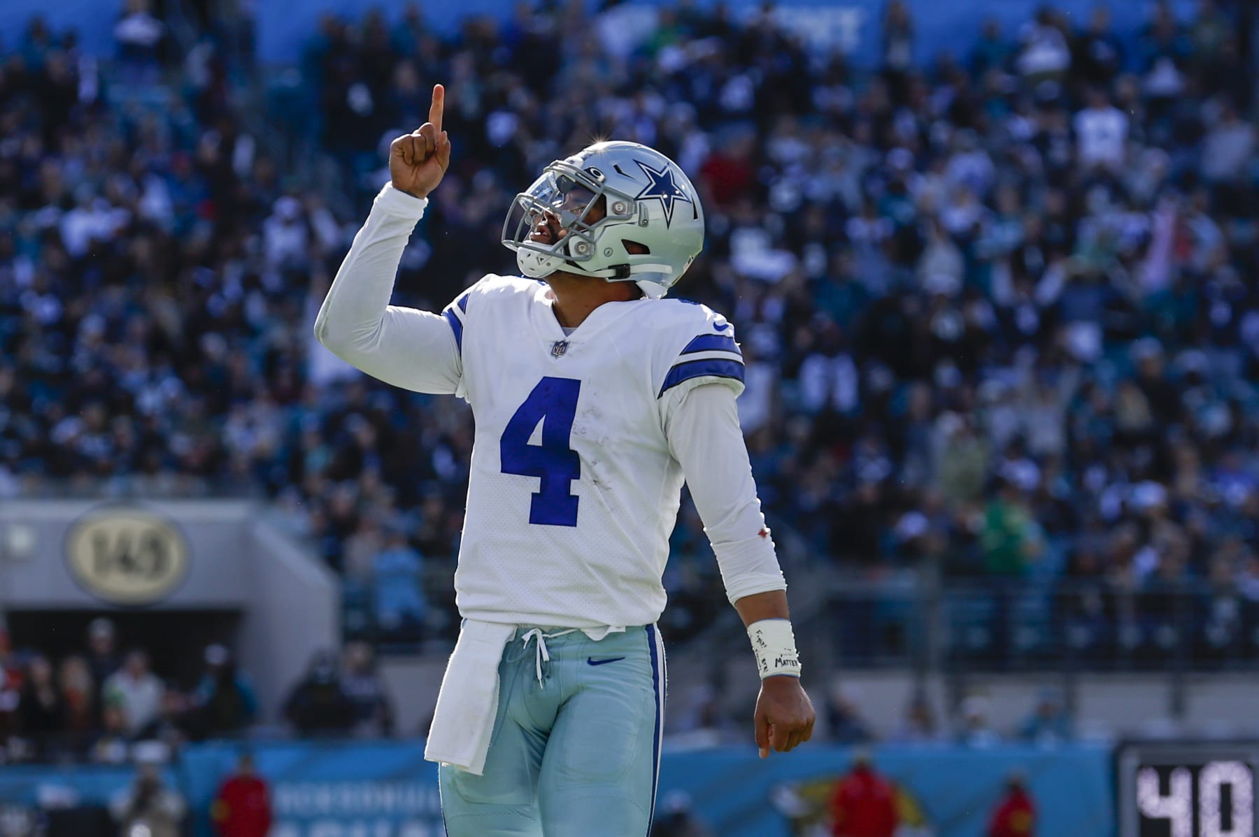 JACKSONVILLE, FL - DECEMBER 18: Dallas Cowboys quarterback Dak Prescott (4) reacts after throwing a touchdown pass during the game between the Dallas Cowboys and the Jacksonville Jaguars on December 18, 2022 at tIAA Bank Field in Jacksonville, Fl. (Photo by David Rosenblum/Icon Sportswire via Getty Images)