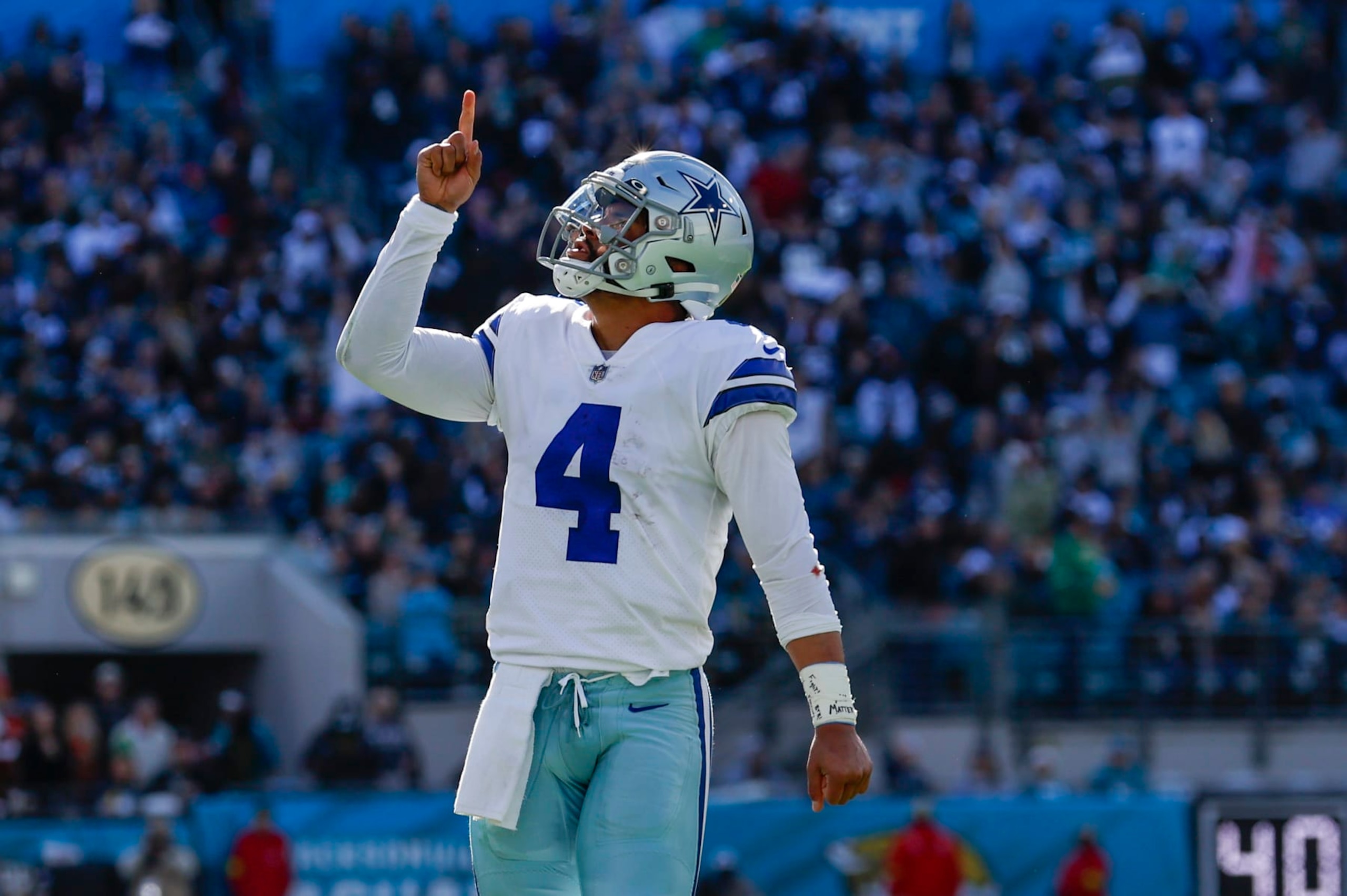 JACKSONVILLE, FL - DECEMBER 18: Dallas Cowboys quarterback Dak Prescott (4) reacts after throwing a touchdown pass during the game between the Dallas Cowboys and the Jacksonville Jaguars on December 18, 2022 at tIAA Bank Field in Jacksonville, Fl. (Photo by David Rosenblum/Icon Sportswire via Getty Images)