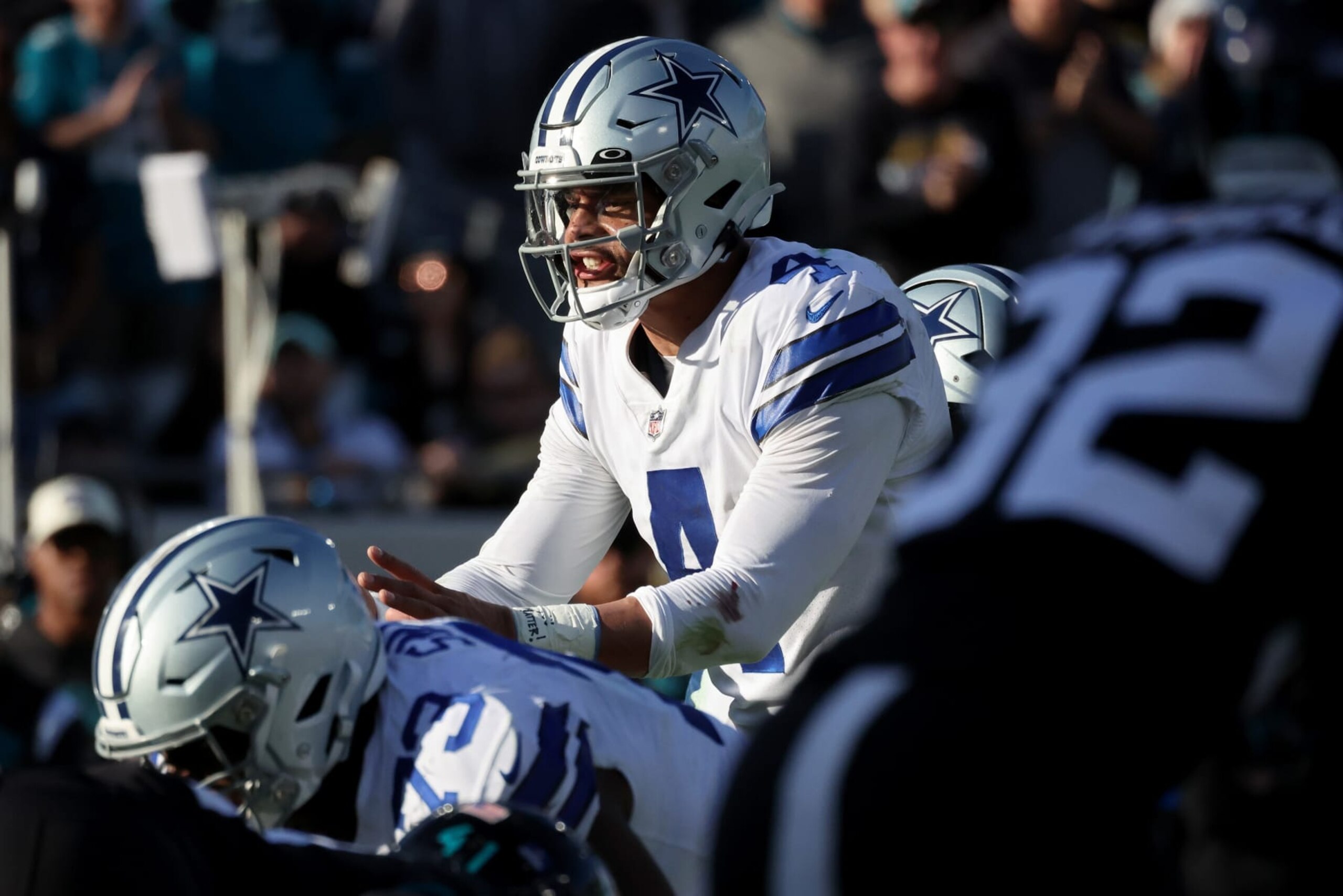 JACKSONVILLE, FLORIDA - DECEMBER 18: Dak Prescott #4 of the Dallas Cowboys looks on at the line of scrimmage against the Jacksonville Jaguars during the second half at TIAA Bank Field on December 18, 2022 in Jacksonville, Florida. (Photo by Mike Carlson/Getty Images)
