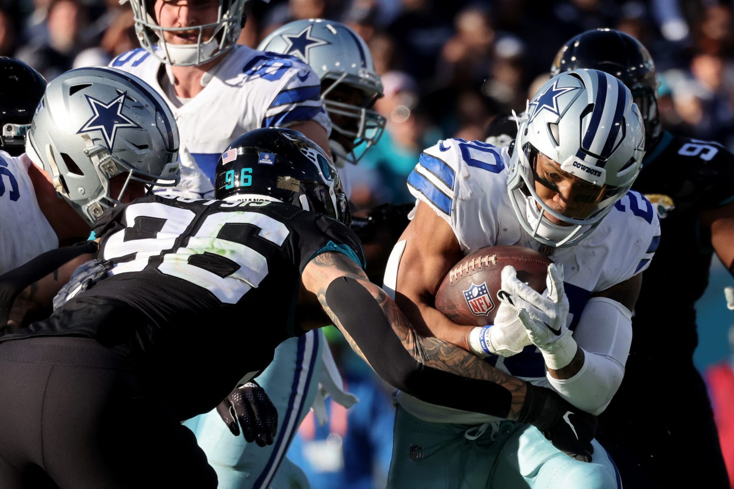JACKSONVILLE, FLORIDA - DECEMBER 18: Tony Pollard #20 of the Dallas Cowboys carries the ball against the Jacksonville Jaguars during the second half at TIAA Bank Field on December 18, 2022 in Jacksonville, Florida. (Photo by Mike Carlson/Getty Images)