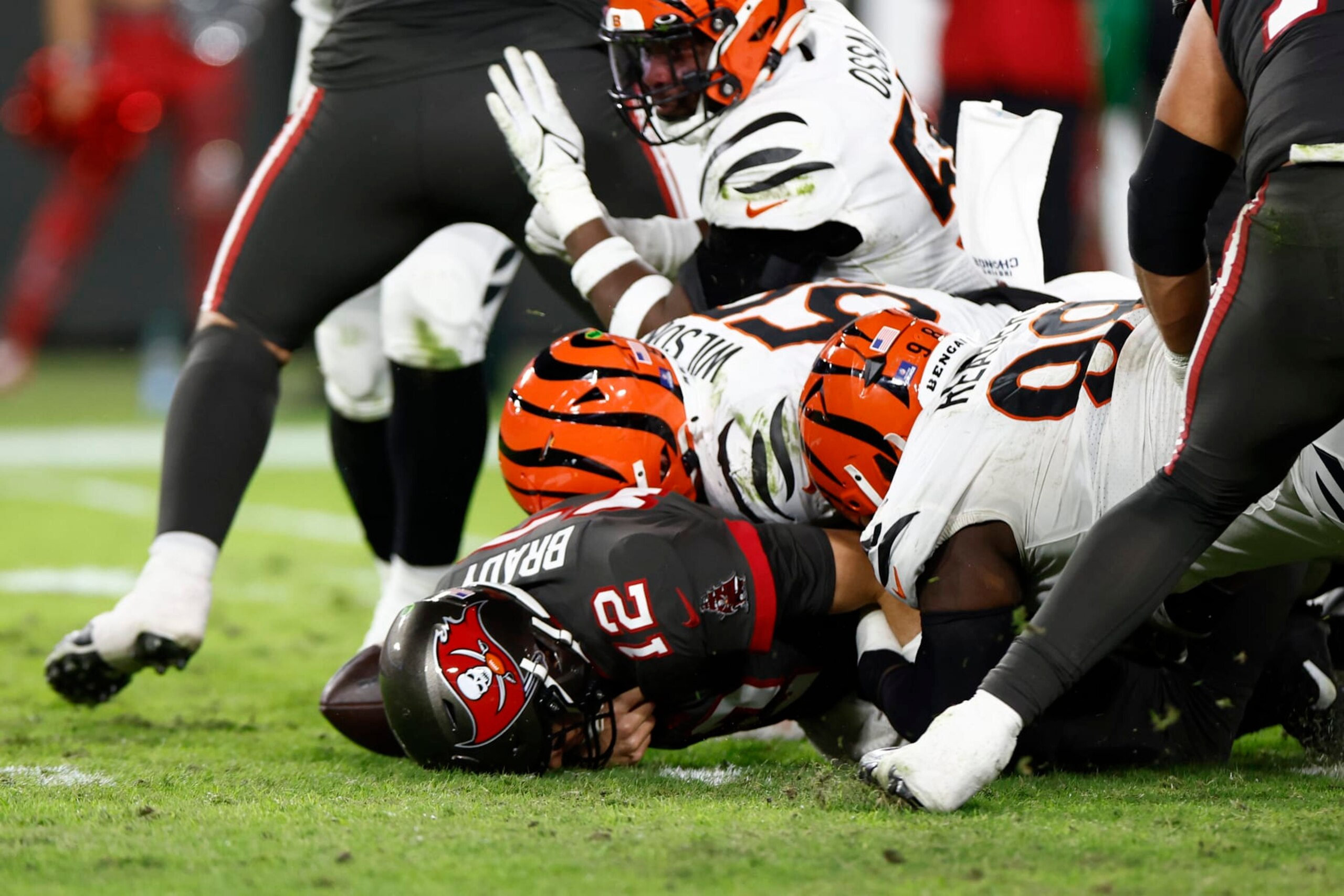 TAMPA, FLORIDA - DECEMBER 18: Tom Brady #12 of the Tampa Bay Buccaneers is sacked and fumbles the ball during the third quarter in the game against the Cincinnati Bengals at Raymond James Stadium on December 18, 2022 in Tampa, Florida. (Photo by Douglas P. DeFelice/Getty Images)