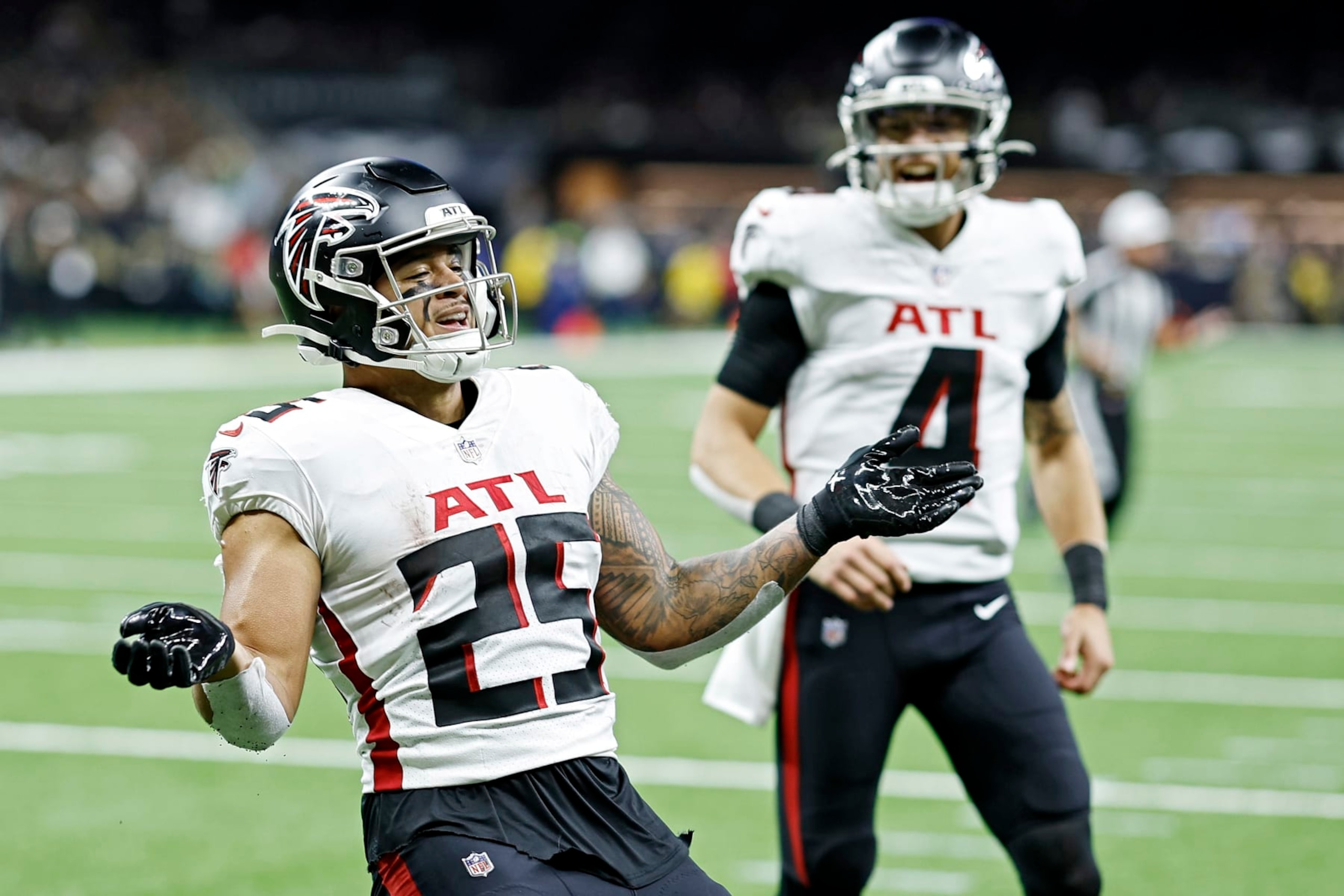 NEW ORLEANS, LOUISIANA - DECEMBER 18: Tyler Allgeier #25 of the Atlanta Falcons celebrates a touchdown during the third quarter in the game against the New Orleans Saints at Caesars Superdome on December 18, 2022 in New Orleans, Louisiana. (Photo by Chris Graythen/Getty Images)