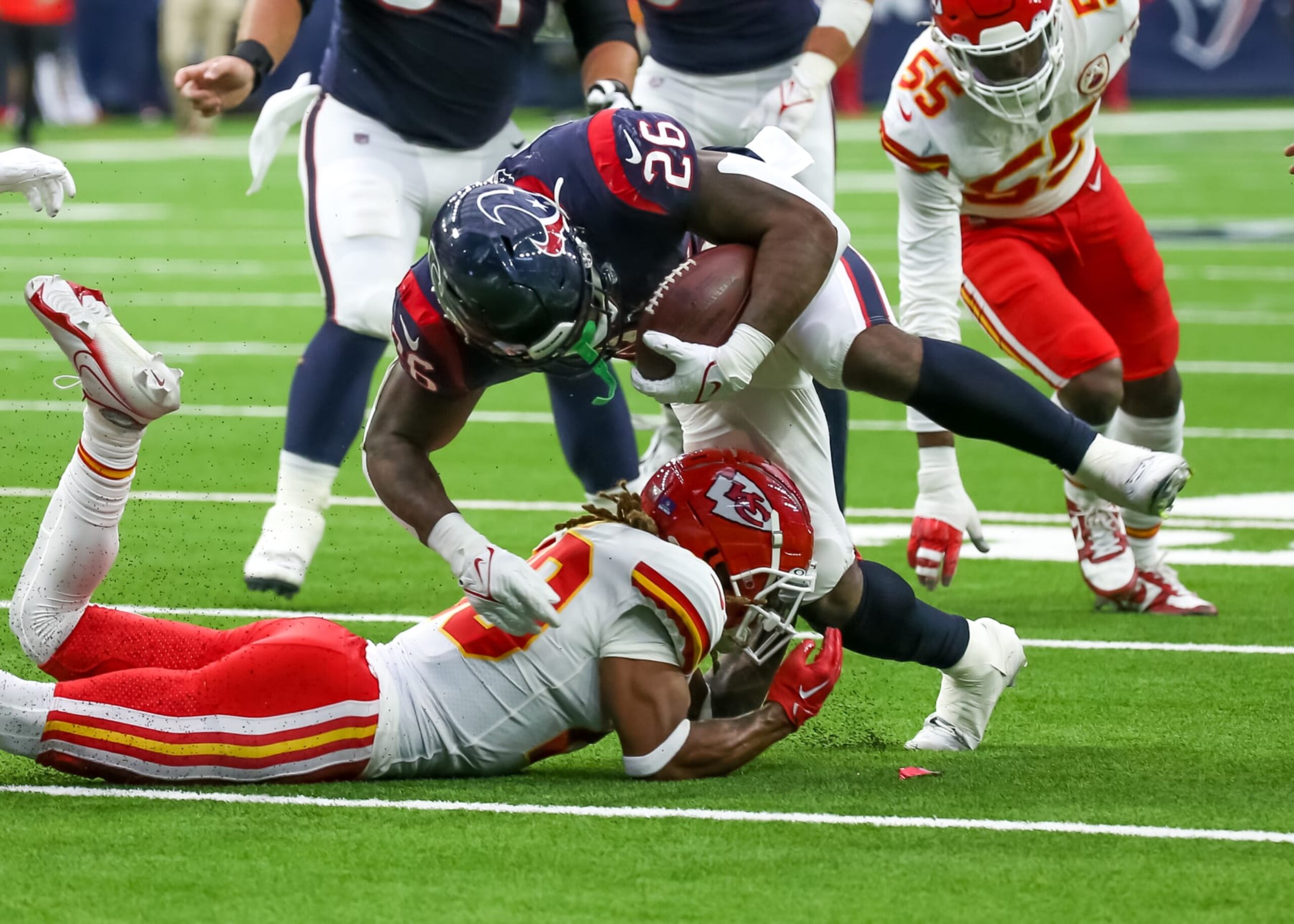 HOUSTON, TX - DECEMBER 18:  Kansas City Chiefs safety Justin Reid (20) dives underneath Houston Texans running back Royce Freeman (26) in the fourth quarter during the NFL game between the Kansas City Chiefs and Houston Texans on December 18, 2022 at NRG Stadium in Houston, Texas.  (Photo by Leslie Plaza Johnson/Icon Sportswire via Getty Images)