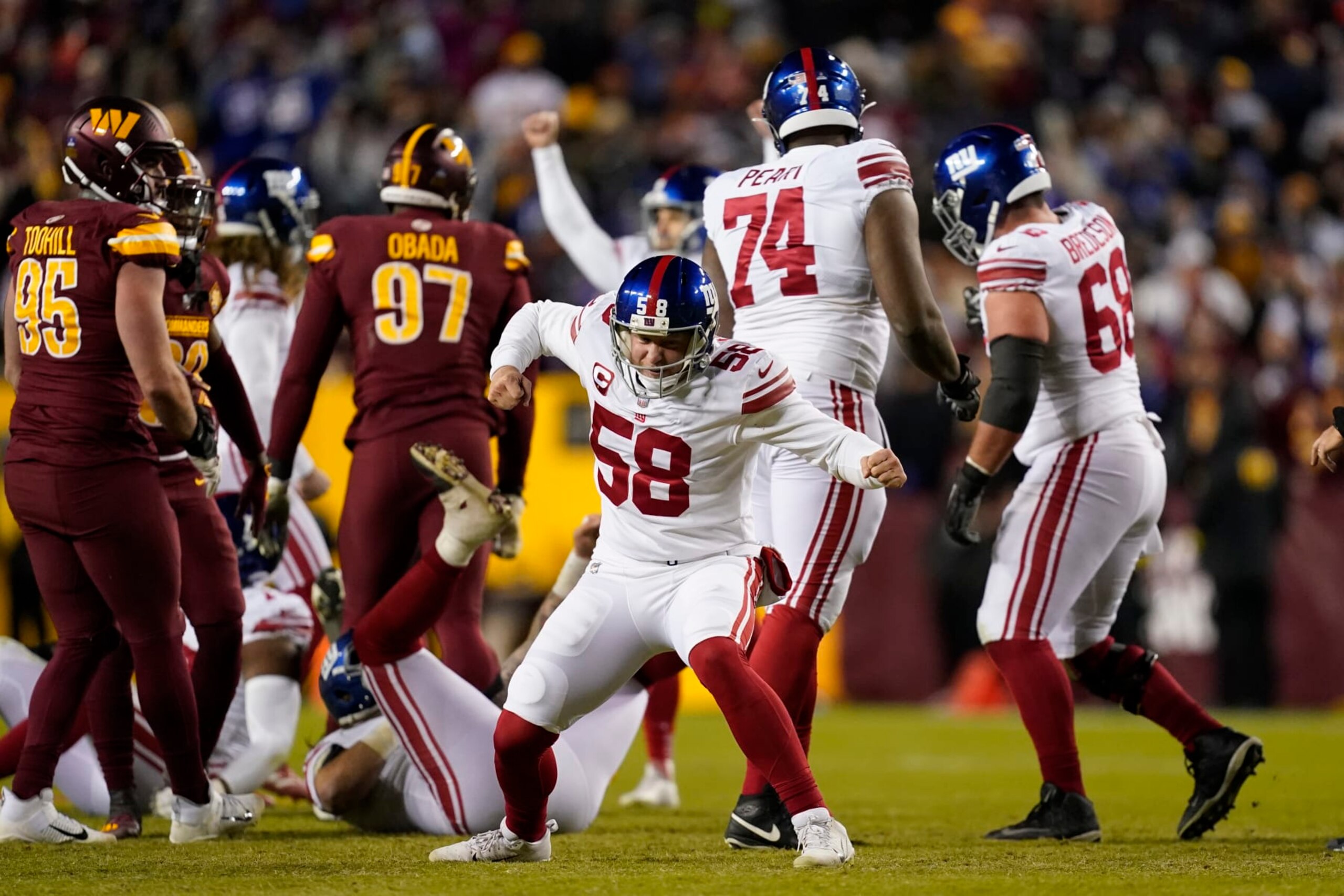 New York Giants long snapper Casey Kreiter (58) celebrates a field goal by teammate Graham Gano during the second half of an NFL football game against the Washington Commanders, Sunday, Dec. 18, 2022, in Landover, Md. (AP Photo/Patrick Semansky) New York Giants long snapper Casey Kreiter (58) celebrates a field goal by teammate Graham Gano during the second half of an NFL football game against the Washington Commanders, Sunday, Dec. 18, 2022, in Landover, Md. (AP Photo/Patrick Semansky)