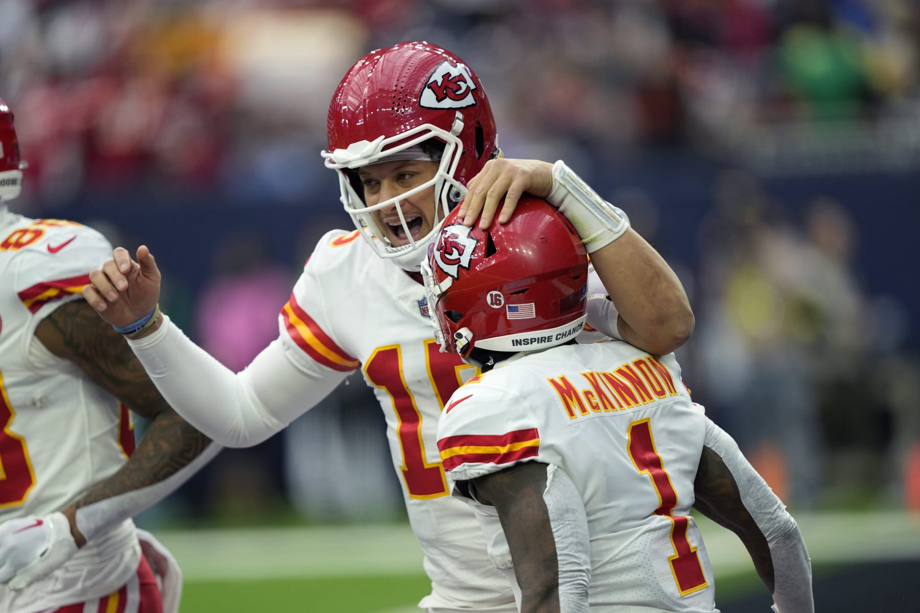 Kansas City Chiefs quarterback Patrick Mahomes (15) and running back Jerick McKinnon (1) celebrate after they connected on a pass for a touchdown against the Houston Texans during the first half of an NFL football game Sunday, Dec. 18, 2022, in Houston. (AP Photo/David J. Phillip)