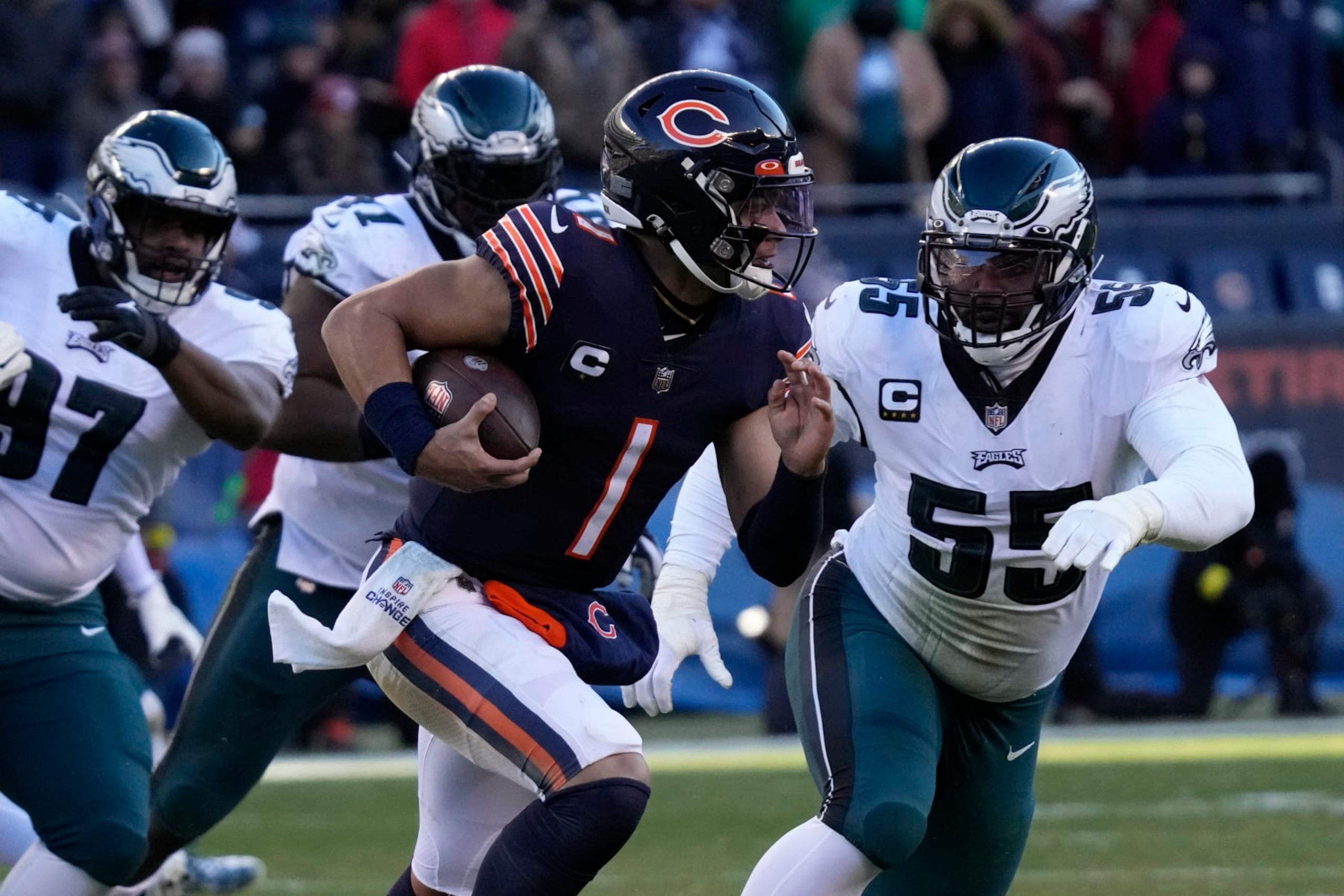 Chicago Bears' Justin Fields runs during the second half of an NFL football game against the Philadelphia Eagles, Sunday, Dec. 18, 2022, in Chicago. (AP Photo/Nam Y. Huh)
