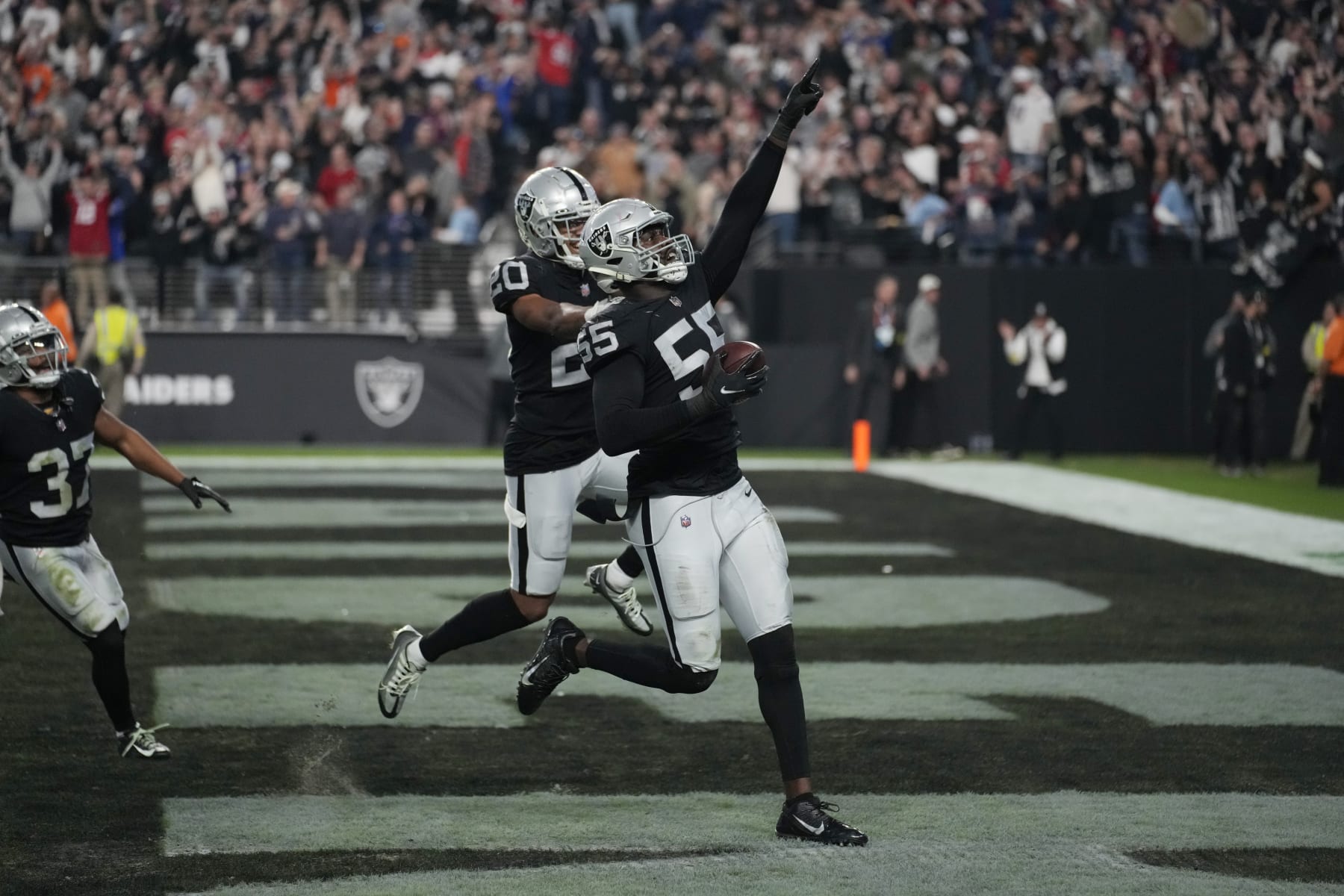 Las Vegas Raiders defensive end Chandler Jones celebrates after scoring on an interception during the second half of an NFL football game, Sunday, Dec. 18, 2022, in Las Vegas. (AP Photo/John Locher)