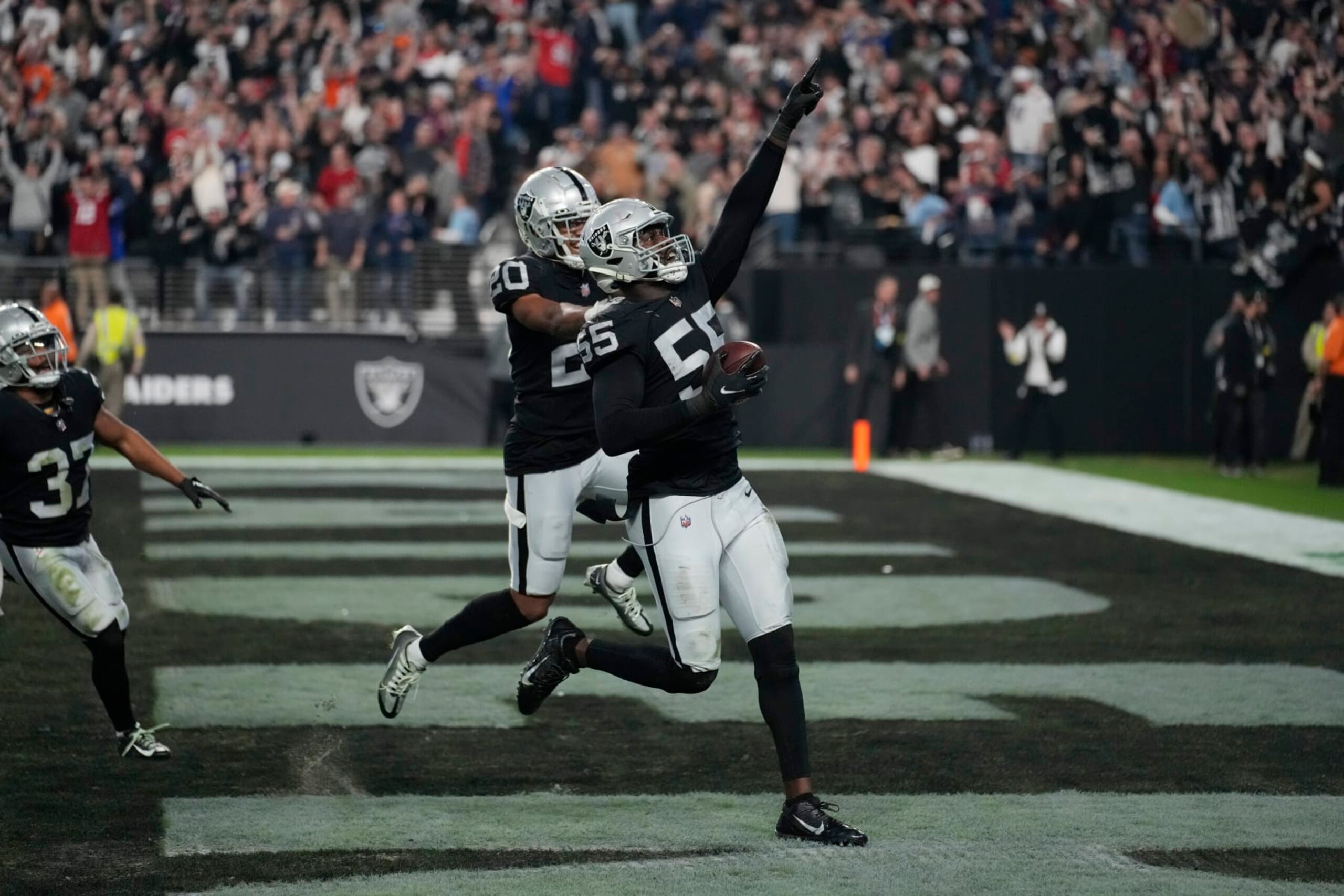 Las Vegas Raiders defensive end Chandler Jones celebrates after scoring on an interception during the second half of an NFL football game, Sunday, Dec. 18, 2022, in Las Vegas. (AP Photo/John Locher)