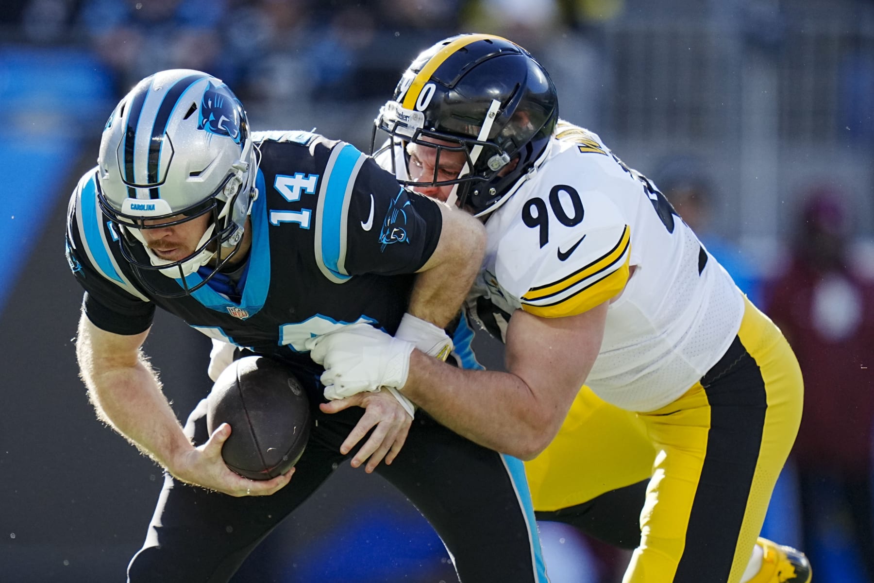 Carolina Panthers quarterback Sam Darnold is sacked by Pittsburgh Steelers linebacker T.J. Watt during the first half of an NFL football game between the Carolina Panthers and the Pittsburgh Steelers on Sunday, Dec. 18, 2022, in Charlotte, N.C. (AP Photo/Rusty Jones)