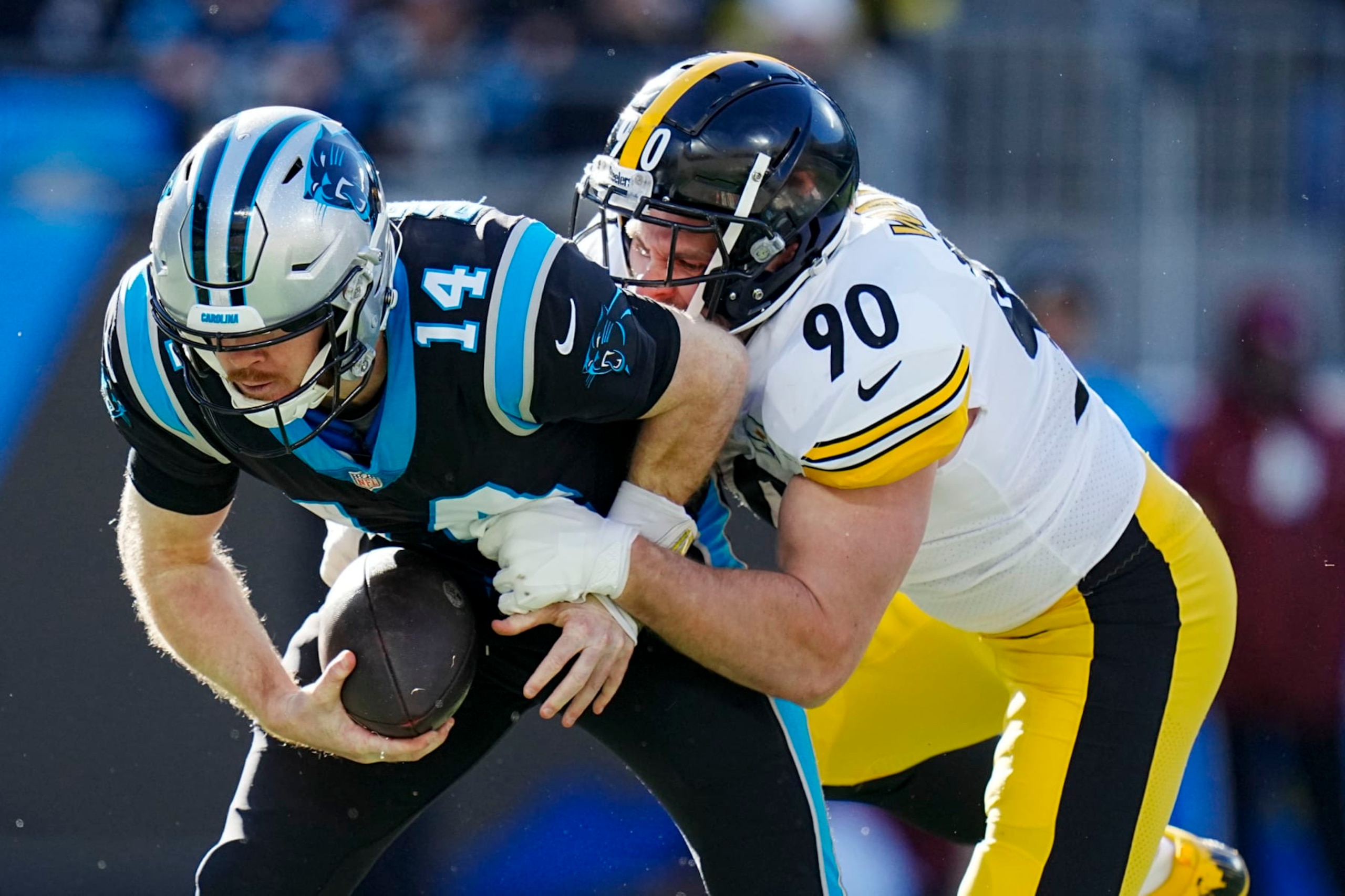 Carolina Panthers quarterback Sam Darnold is sacked by Pittsburgh Steelers linebacker T.J. Watt during the first half of an NFL football game between the Carolina Panthers and the Pittsburgh Steelers on Sunday, Dec. 18, 2022, in Charlotte, N.C. (AP Photo/Rusty Jones)