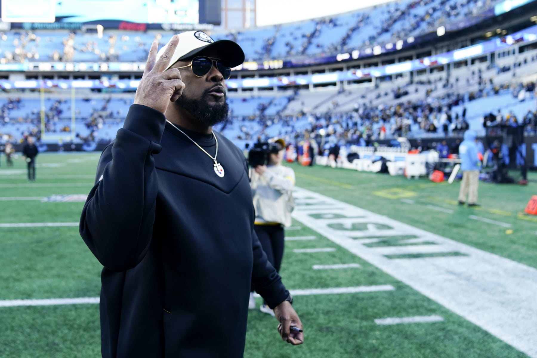Pittsburgh Steelers head coach Mike Tomlin leaves the field after their win against the Carolina Panthers in an NFL football game between the Carolina Panthers and the Pittsburgh Steelers on Sunday, Dec. 18, 2022, in Charlotte, N.C. (AP Photo/Jacob Kupferman)