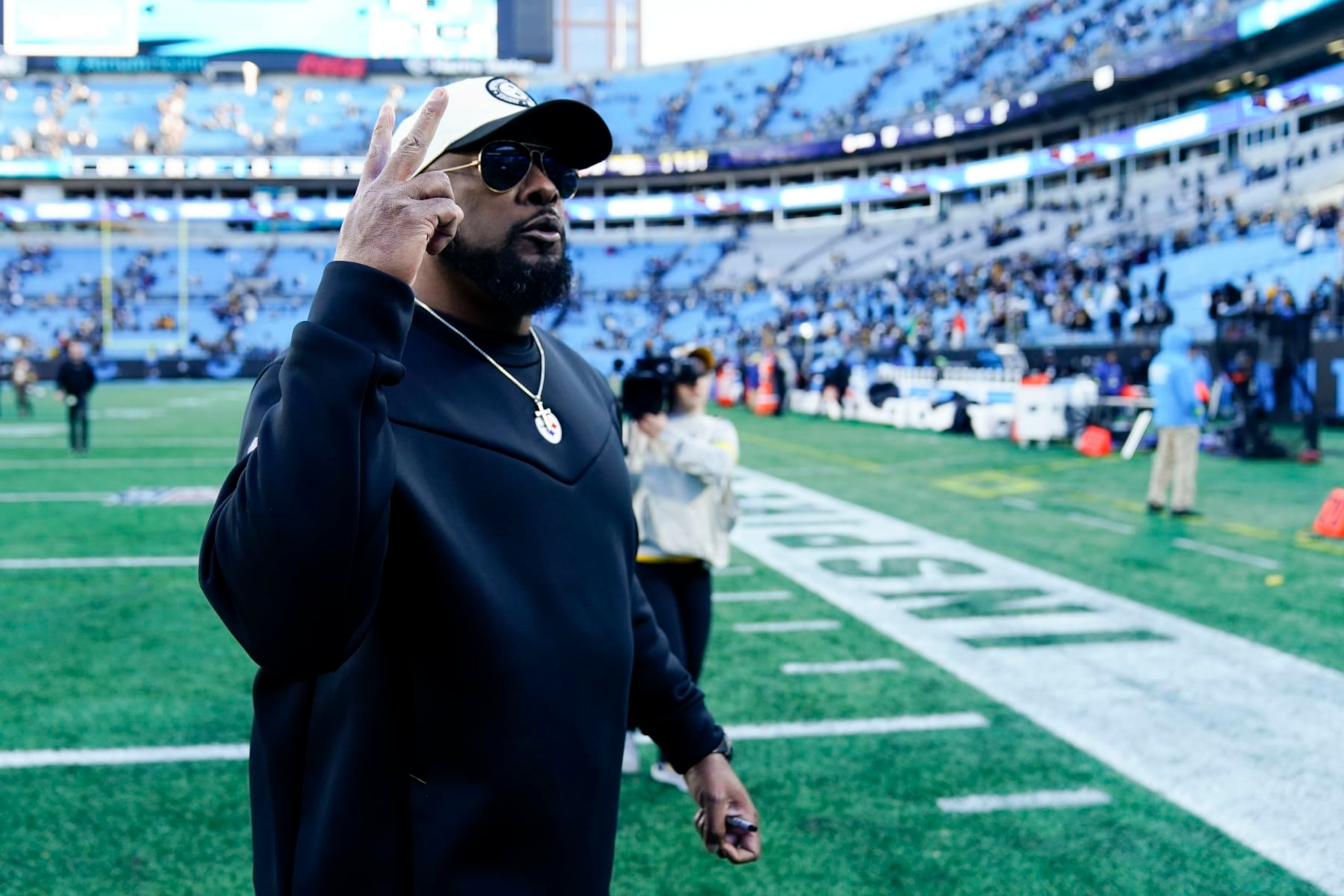 Pittsburgh Steelers head coach Mike Tomlin leaves the field after their win against the Carolina Panthers in an NFL football game between the Carolina Panthers and the Pittsburgh Steelers on Sunday, Dec. 18, 2022, in Charlotte, N.C. (AP Photo/Jacob Kupferman)