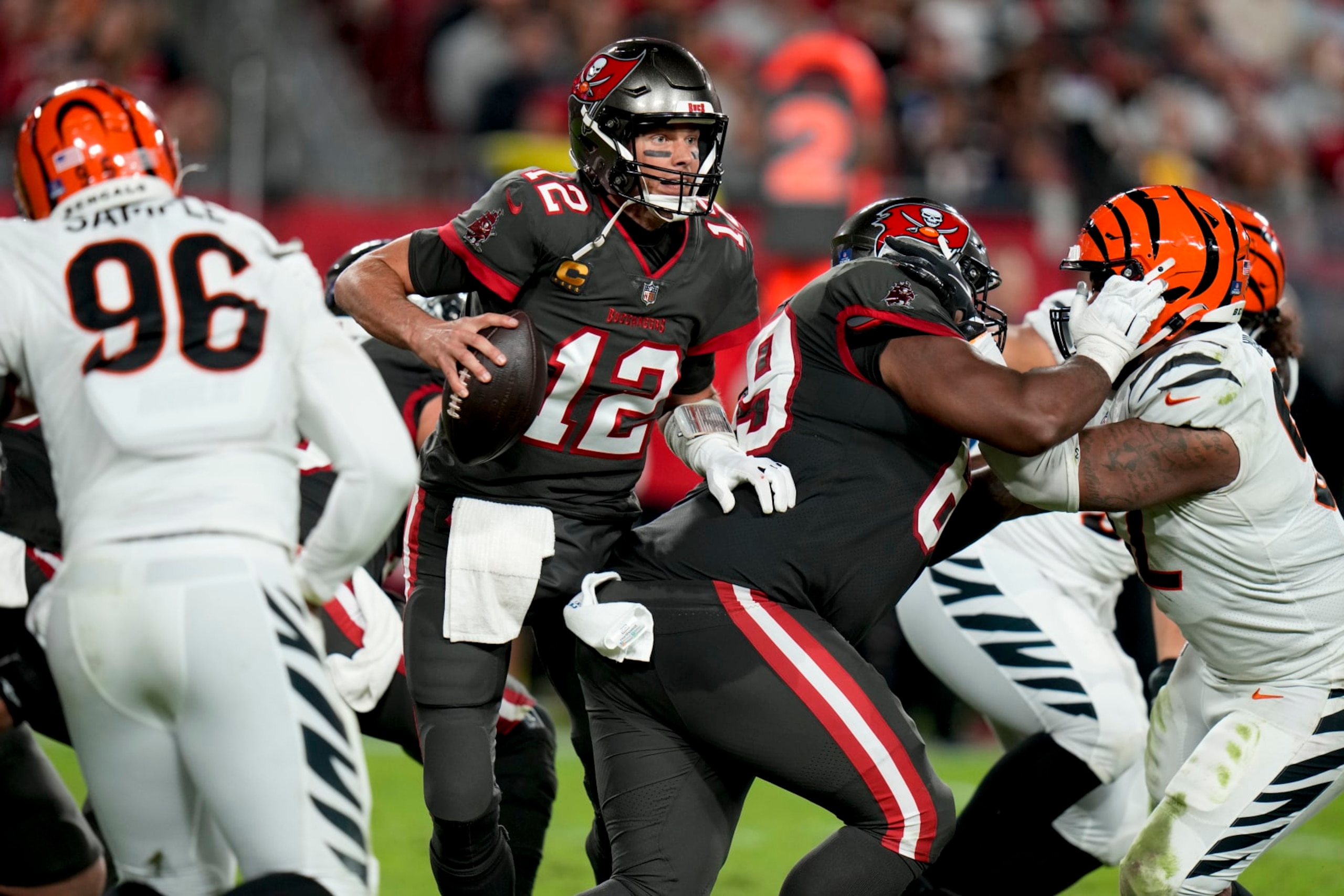 Tampa Bay Buccaneers quarterback Tom Brady (12) works against the Cincinnati Bengals during the second half of an NFL football game, Sunday, Dec. 18, 2022, in Tampa, Fla. (AP Photo/Chris O'Meara)