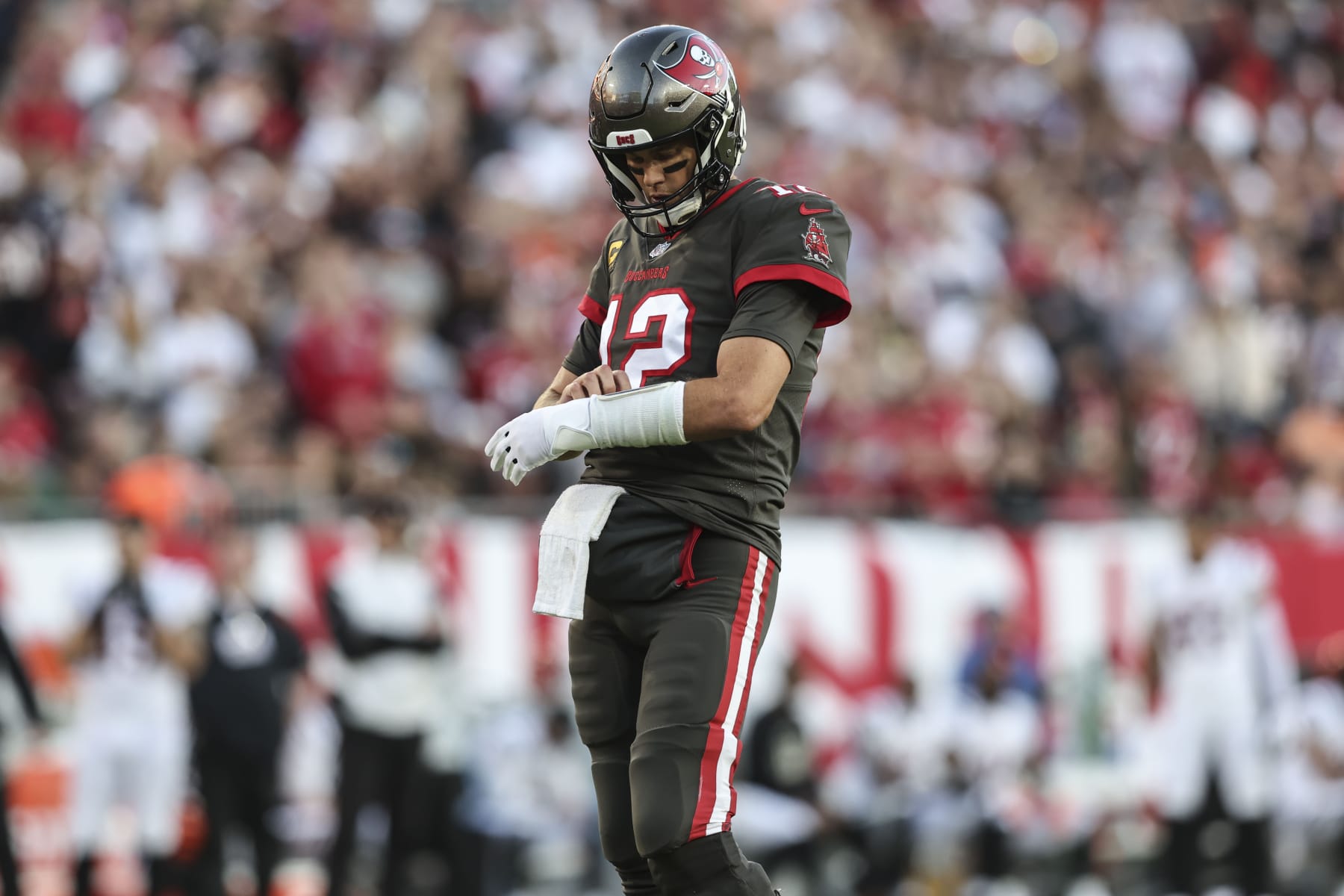 Tampa Bay Buccaneers quarterback Tom Brady (12) leaves the field during the first half of an NFL football game against the Cincinnati Bengals, Sunday, Dec. 18, 2022, in Tampa, Fla. (AP Photo/Mark LoMoglio)