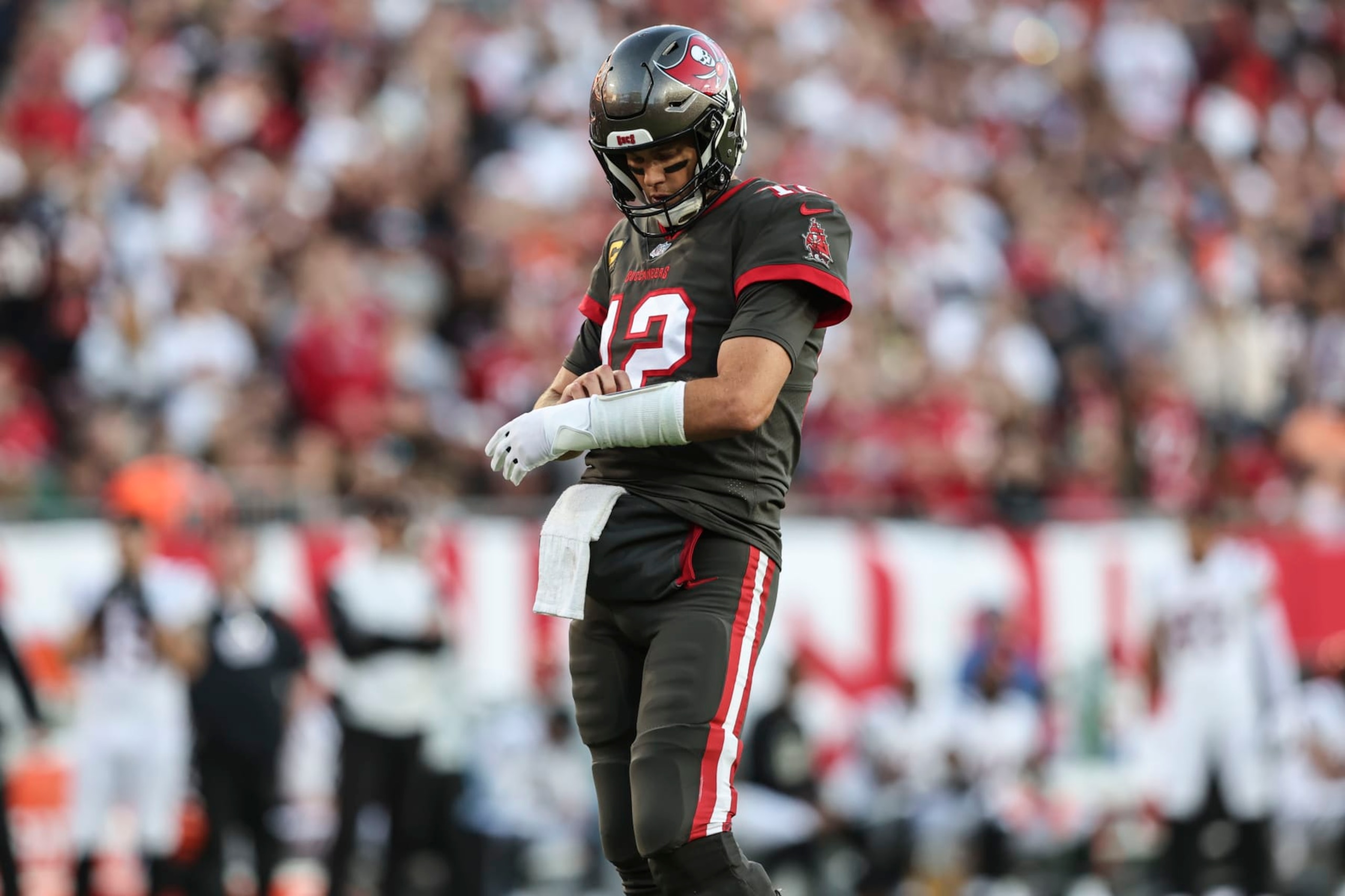 Tampa Bay Buccaneers quarterback Tom Brady (12) leaves the field during the first half of an NFL football game against the Cincinnati Bengals, Sunday, Dec. 18, 2022, in Tampa, Fla. (AP Photo/Mark LoMoglio)