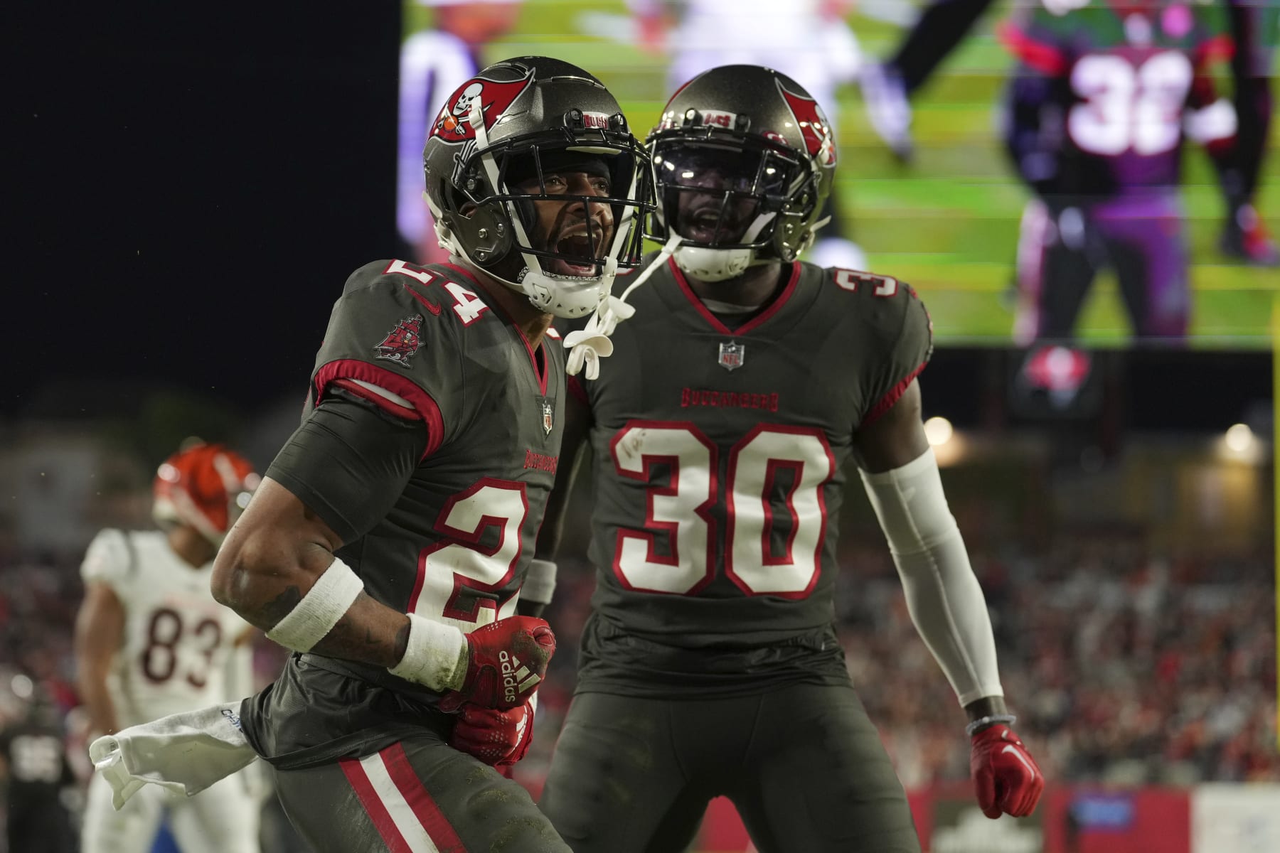 Tampa Bay Buccaneers cornerback Carlton Davis III (24) celebrates with Tampa Bay Buccaneers cornerback Dee Delaney (30)after making a defensive stop in the end zone during an NFL football game against the Cincinnati Bengals, Sunday, Dec. 18, 2022, in Tampa, Fla. (AP Photo/Peter Joneleit)