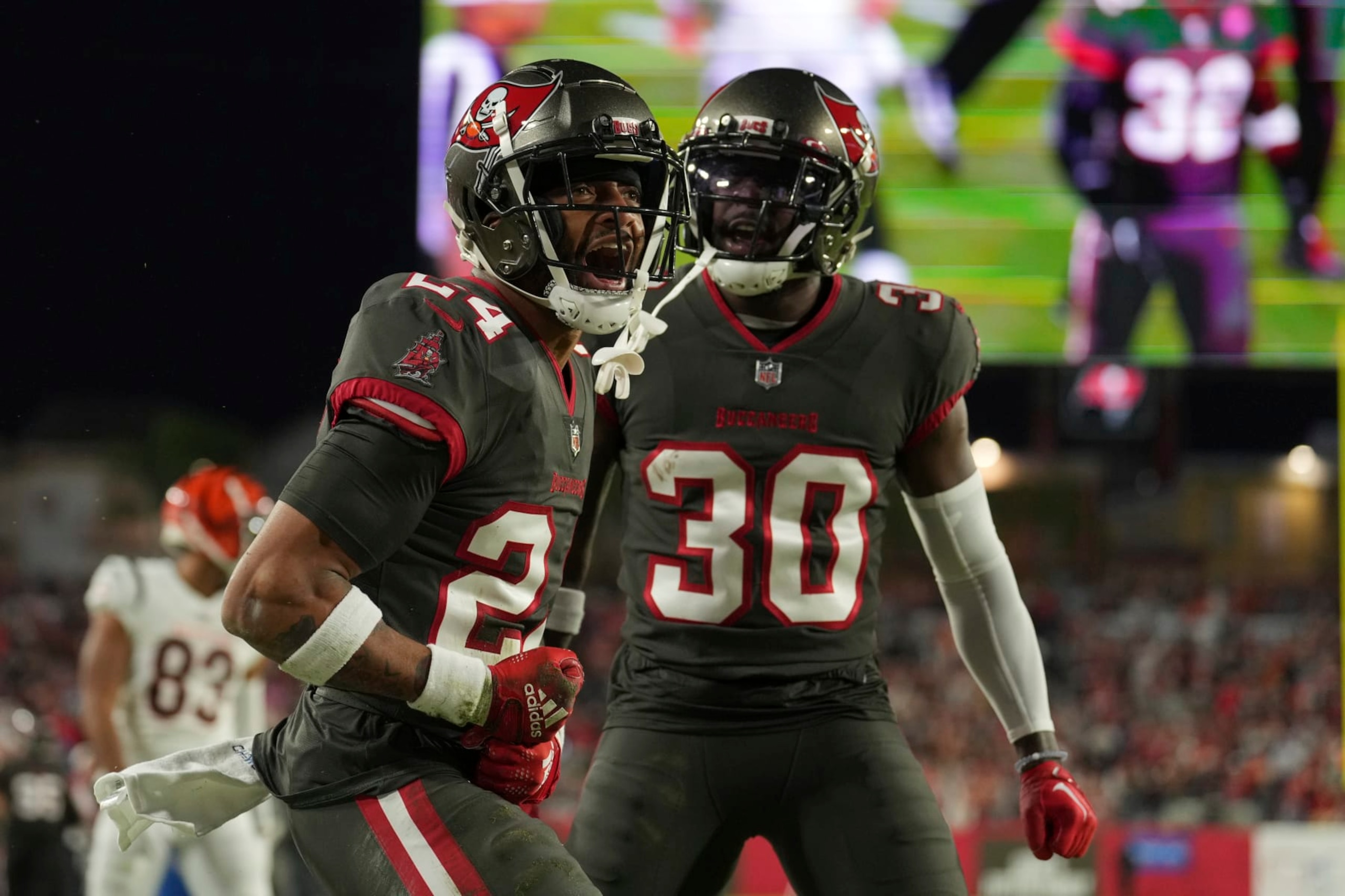Tampa Bay Buccaneers cornerback Carlton Davis III (24) celebrates with Tampa Bay Buccaneers cornerback Dee Delaney (30)after making a defensive stop in the end zone during an NFL football game against the Cincinnati Bengals, Sunday, Dec. 18, 2022, in Tampa, Fla. (AP Photo/Peter Joneleit)