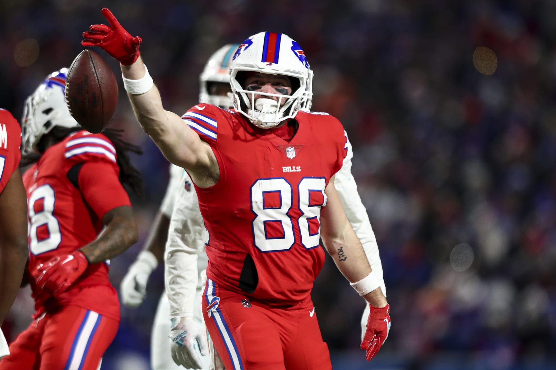 ORCHARD PARK, NY - DECEMBER 17: Dawson Knox #88 of the Buffalo Bills celebrates after a play during the third quarter of an NFL football game against the Miami Dolphins at Highmark Stadium on December 17, 2022 in Orchard Park, New York. (Photo by Kevin Sabitus/Getty Images)
