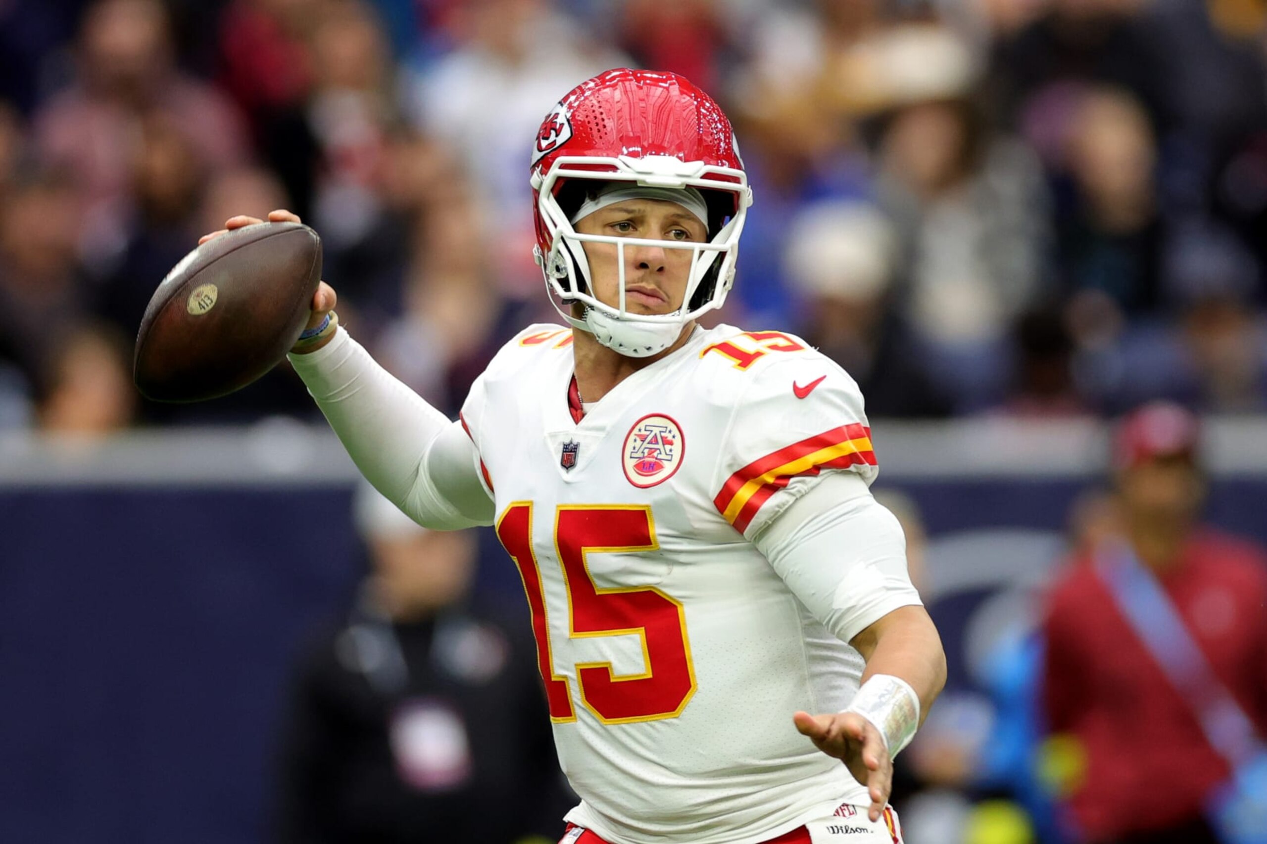 HOUSTON, TEXAS - DECEMBER 18: Patrick Mahomes #15 of the Kansas City Chiefs throws a pass against the Houston Texans during the first half of the game at NRG Stadium on December 18, 2022 in Houston, Texas. (Photo by Carmen Mandato/Getty Images)