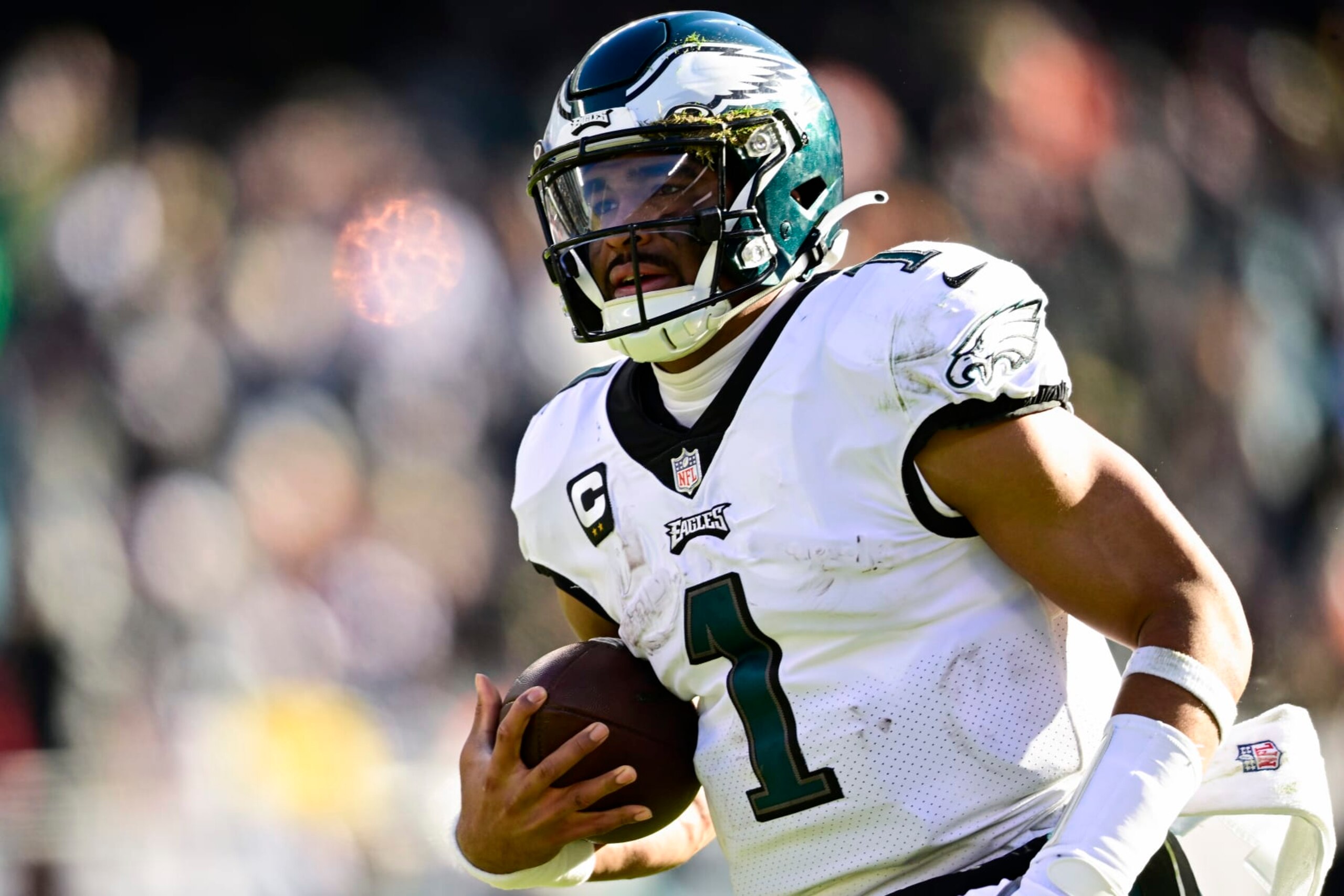 CHICAGO, ILLINOIS - DECEMBER 18: Jalen Hurts #1 of the Philadelphia Eagles runs the ball for a touchdown during the second quarter in the game against the Chicago Bears at Soldier Field on December 18, 2022 in Chicago, Illinois. (Photo by Quinn Harris/Getty Images)