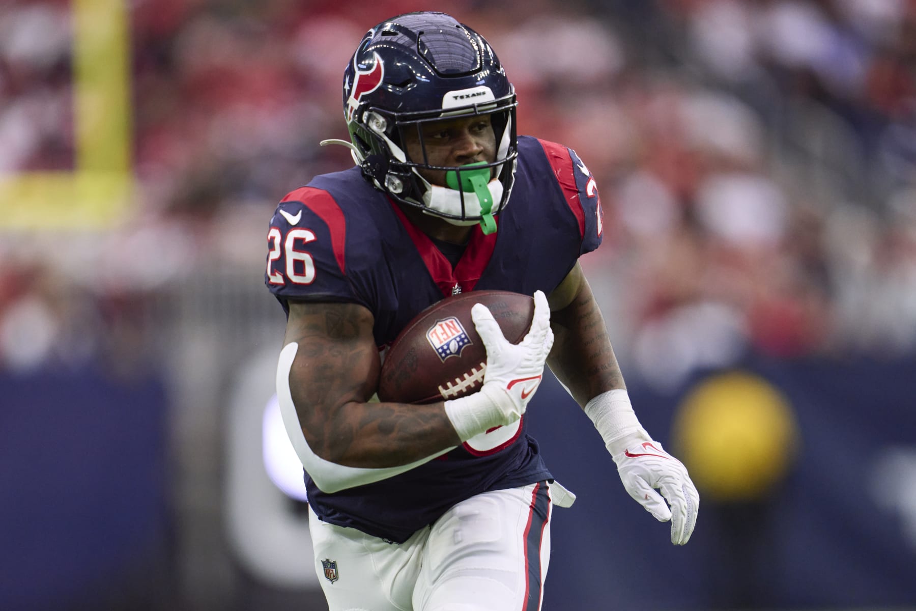 HOUSTON, TX - DECEMBER 18: Royce Freeman #26 of the Houston Texans runs with the ball against the Kansas City Chiefs during the second half at NRG Stadium on December 18, 2022 in Houston, Texas. (Photo by Cooper Neill/Getty Images)