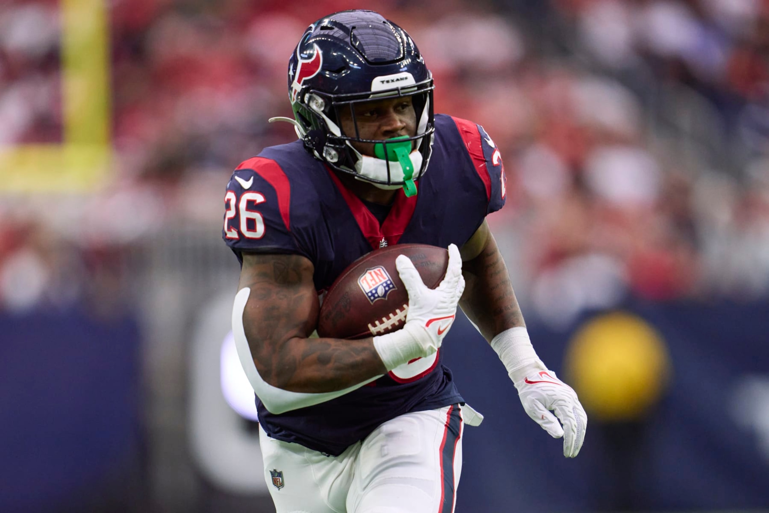 HOUSTON, TX - DECEMBER 18: Royce Freeman #26 of the Houston Texans runs with the ball against the Kansas City Chiefs during the second half at NRG Stadium on December 18, 2022 in Houston, Texas. (Photo by Cooper Neill/Getty Images)