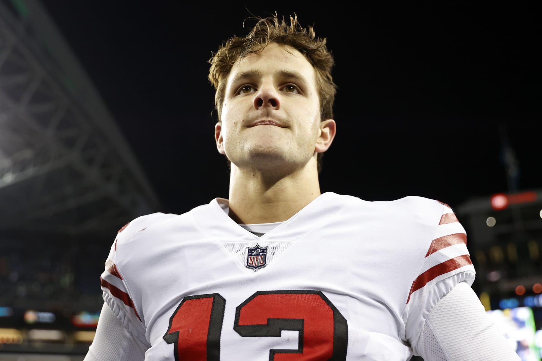 SEATTLE, WASHINGTON - DECEMBER 15: Brock Purdy #13 of the San Francisco 49ers looks on after defeating the Seattle Seahawks at Lumen Field on December 15, 2022 in Seattle, Washington. (Photo by Steph Chambers/Getty Images)