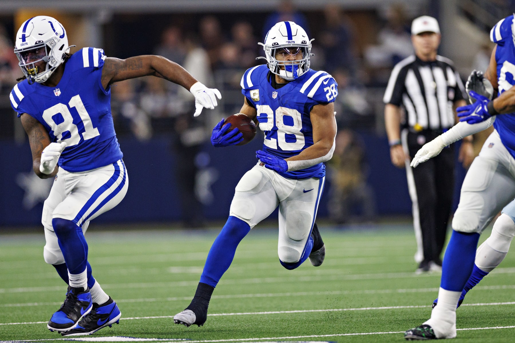 ARLINGTON, TEXAS - DECEMBER 4:  Jonathan Taylor #28 of the Indianapolis Colts runs the ball during a game against the Dallas Cowboys at AT&T Stadium on December 4, 2022 in Arlington, Texas. The Cowboys defeated the Colts 54-19. (Photo by Wesley Hitt/Getty Images)