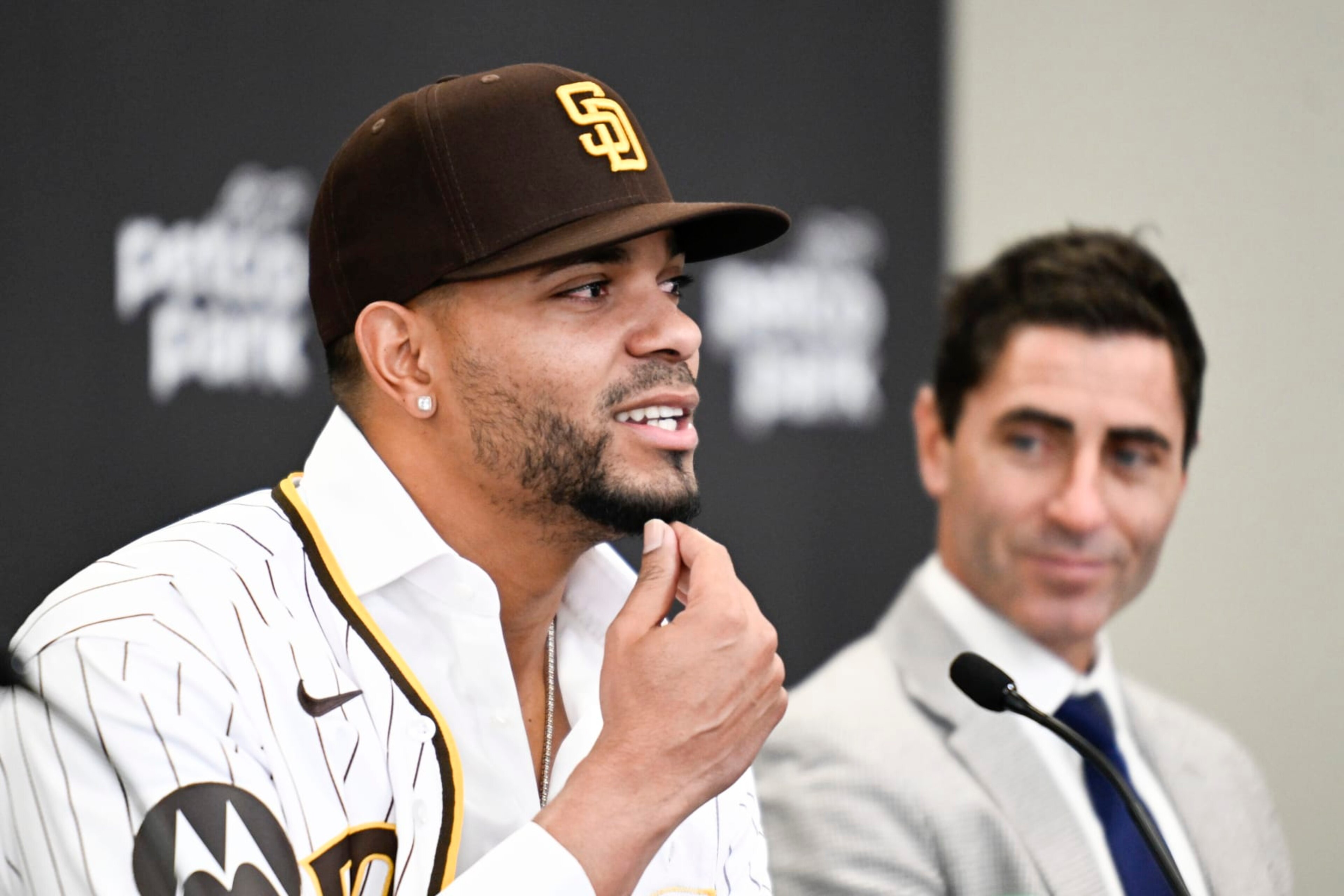 San Diego Padres' Xander Bogaerts, left, plays with his beard as general manager A.J. Preller looks on at a news conference held to announce that Bogaerts' $280 million, 11-year contact with the Padres has been finalized, Friday, Dec. 9, 2022, in San Diego. (AP Photo/Denis Poroy) San Diego Padres' Xander Bogaerts, left, plays with his beard as general manager A.J. Preller looks on at a news conference held to announce that Bogaerts' $280 million, 11-year contact with the Padres has been finalized, Friday, Dec. 9, 2022, in San Diego. (AP Photo/Denis Poroy)