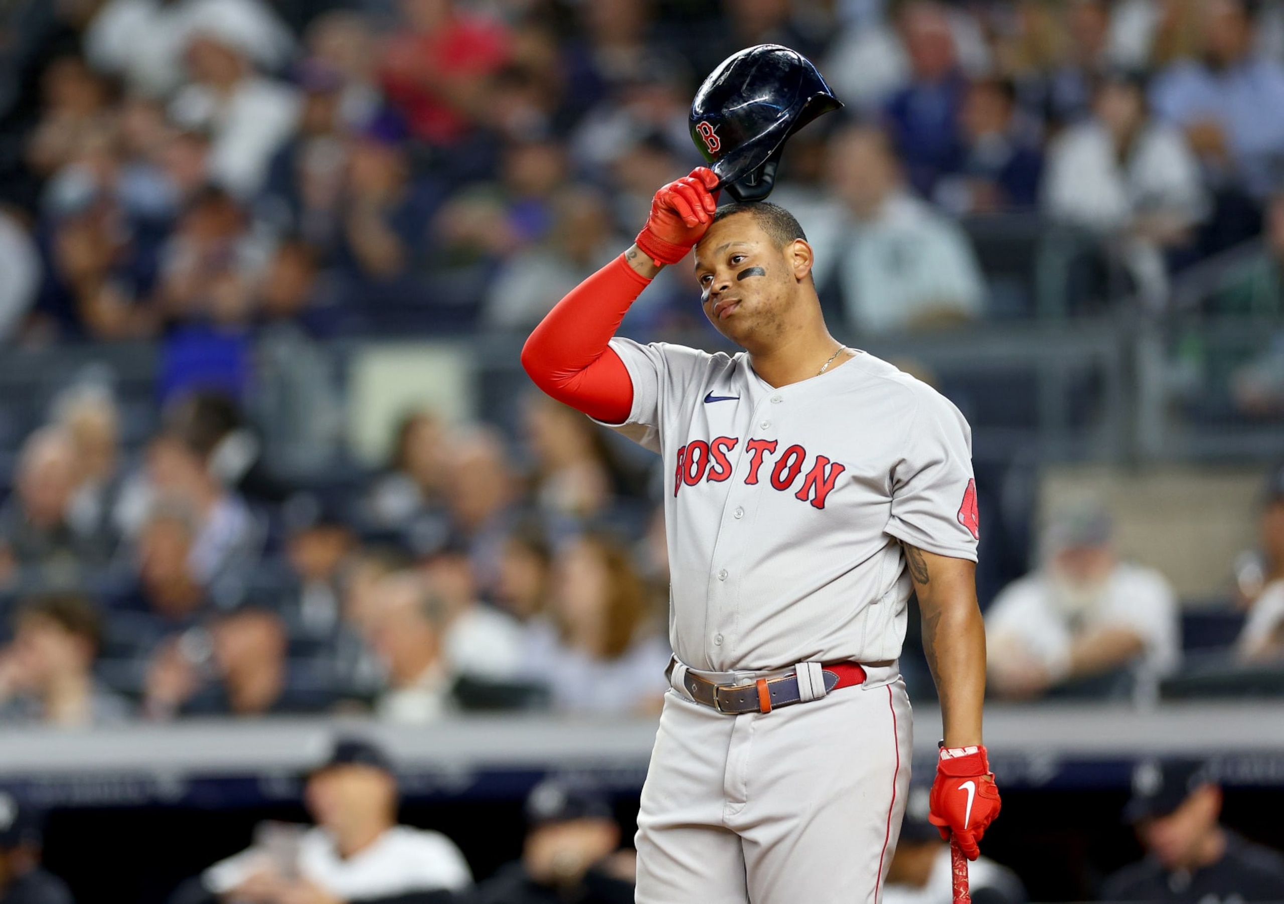 NEW YORK, NEW YORK - SEPTEMBER 22:  Rafael Devers #11 of the Boston Red Sox reacts during his at bat in the third inning against the New York Yankees at Yankee Stadium on September 22, 2022 in the Bronx borough of New York City. (Photo by Elsa/Getty Images)