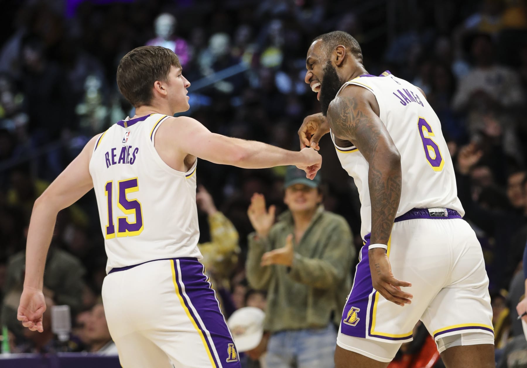 LOS ANGELES, CALIFORNIA - DECEMBER 18: Austin Reaves #15 and LeBron James #6 of the Los Angeles Lakers celebrate their point in the first half against the Washington Wizards at Crypto.com Arena on December 18, 2022 in Los Angeles, California. NOTE TO USER: User expressly acknowledges and agrees that, by downloading and or using this photograph, User is consenting to the terms and conditions of the Getty Images License Agreement. (Photo by Meg Oliphant/Getty Images)