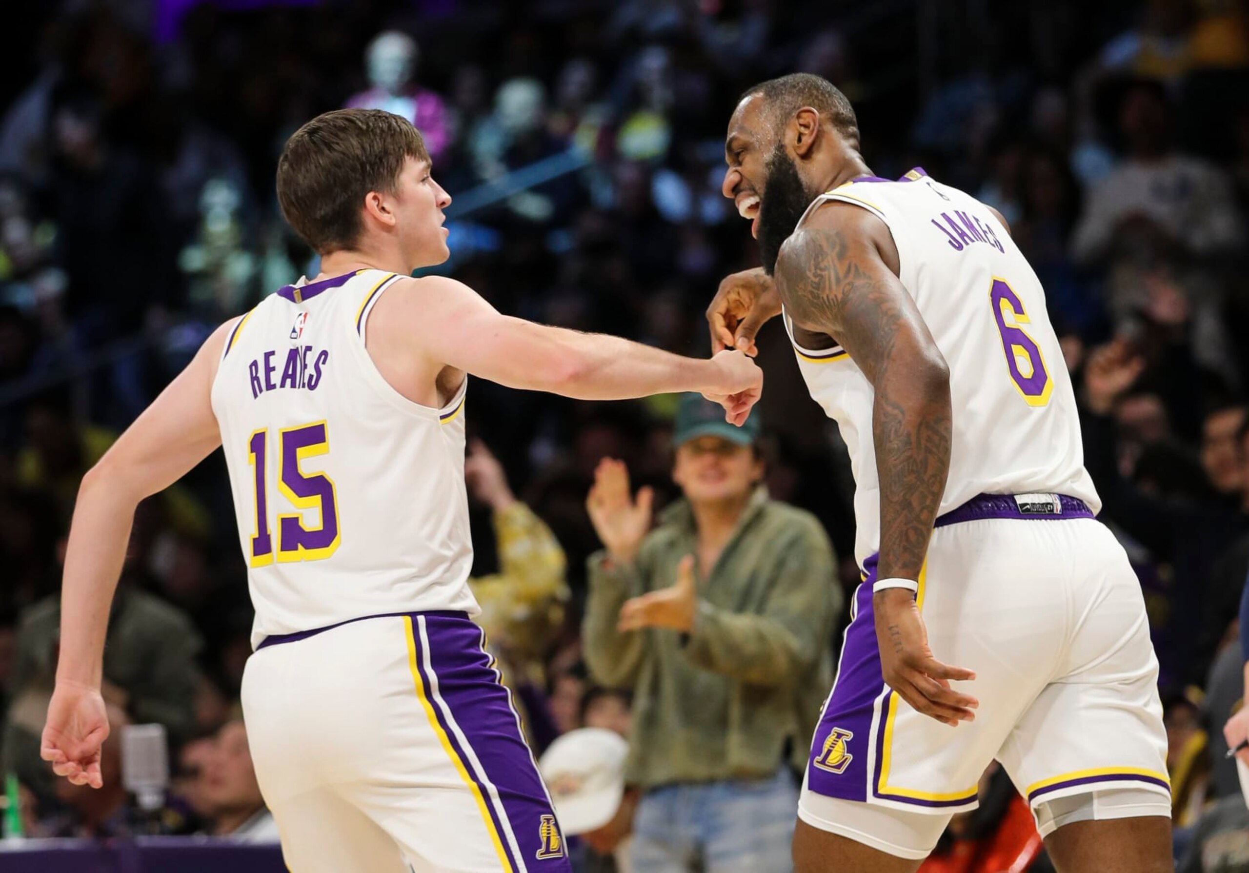 LOS ANGELES, CALIFORNIA - DECEMBER 18: Austin Reaves #15 and LeBron James #6 of the Los Angeles Lakers celebrate their point in the first half against the Washington Wizards at Crypto.com Arena on December 18, 2022 in Los Angeles, California. NOTE TO USER: User expressly acknowledges and agrees that, by downloading and or using this photograph, User is consenting to the terms and conditions of the Getty Images License Agreement. (Photo by Meg Oliphant/Getty Images)