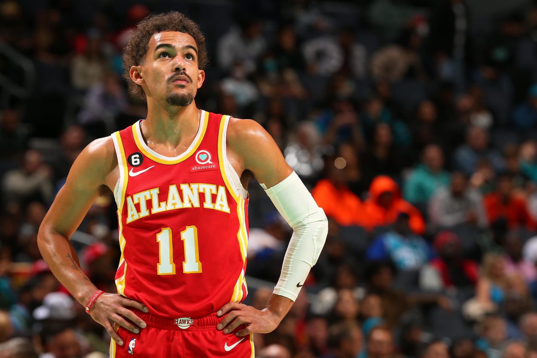 CHARLOTTE, NC - DECEMBER 16: Trae Young #11 of the Atlanta Hawks looks on during the game against the Charlotte Hornets on December 16, 2022 at Spectrum Center in Charlotte, North Carolina. NOTE TO USER: User expressly acknowledges and agrees that, by downloading and or using this photograph, User is consenting to the terms and conditions of the Getty Images License Agreement. Mandatory Copyright Notice: Copyright 2022 NBAE (Photo by Kent Smith/NBAE via Getty Images)