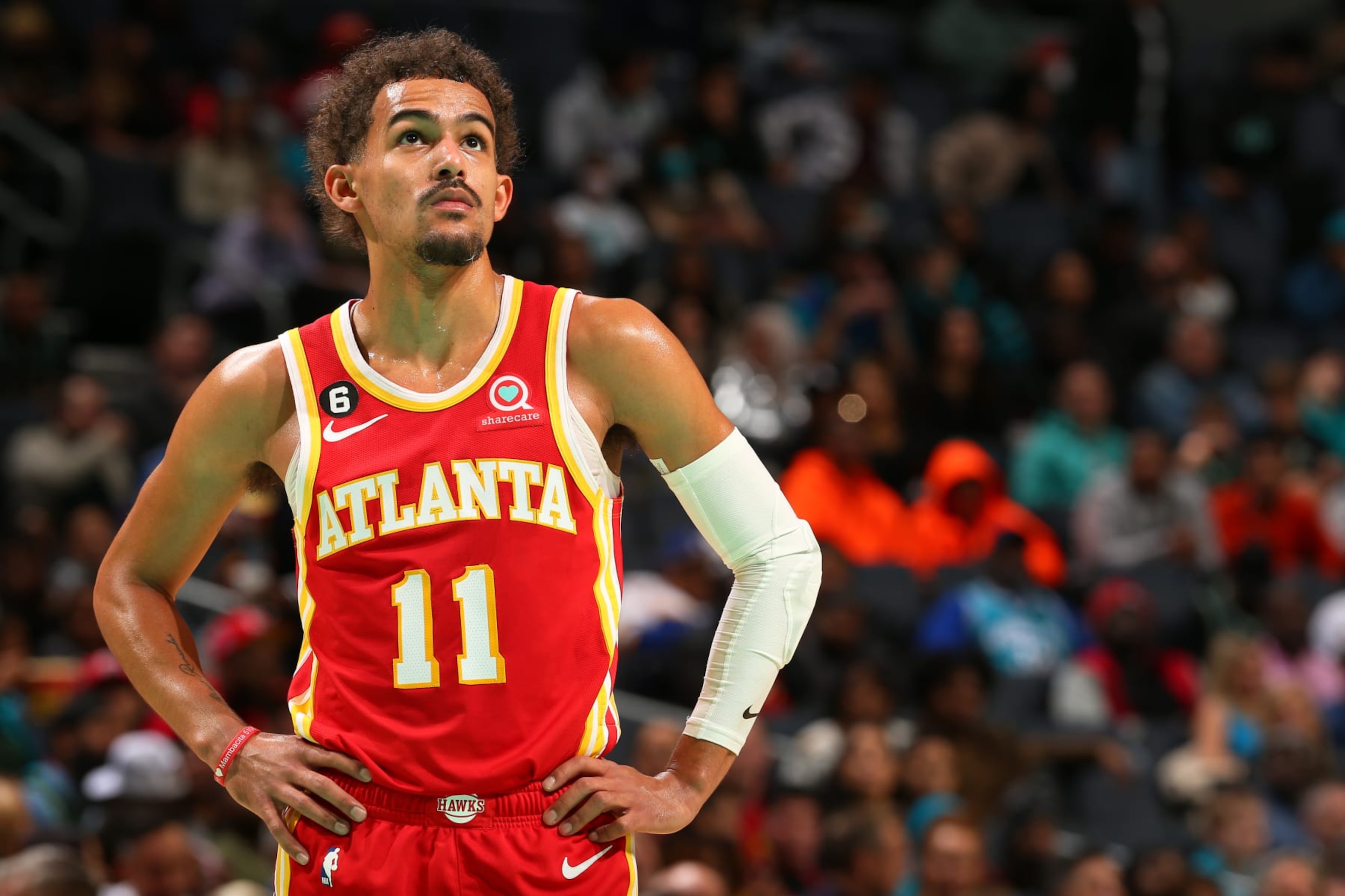 CHARLOTTE, NC - DECEMBER 16: Trae Young #11 of the Atlanta Hawks looks on during the game against the Charlotte Hornets on December 16, 2022 at Spectrum Center in Charlotte, North Carolina. NOTE TO USER: User expressly acknowledges and agrees that, by downloading and or using this photograph, User is consenting to the terms and conditions of the Getty Images License Agreement. Mandatory Copyright Notice: Copyright 2022 NBAE (Photo by Kent Smith/NBAE via Getty Images) CHARLOTTE, NC - DECEMBER 16: Trae Young #11 of the Atlanta Hawks looks on during the game against the Charlotte Hornets on December 16, 2022 at Spectrum Center in Charlotte, North Carolina. NOTE TO USER: User expressly acknowledges and agrees that, by downloading and or using this photograph, User is consenting to the terms and conditions of the Getty Images License Agreement. Mandatory Copyright Notice: Copyright 2022 NBAE (Photo by Kent Smith/NBAE via Getty Images)
