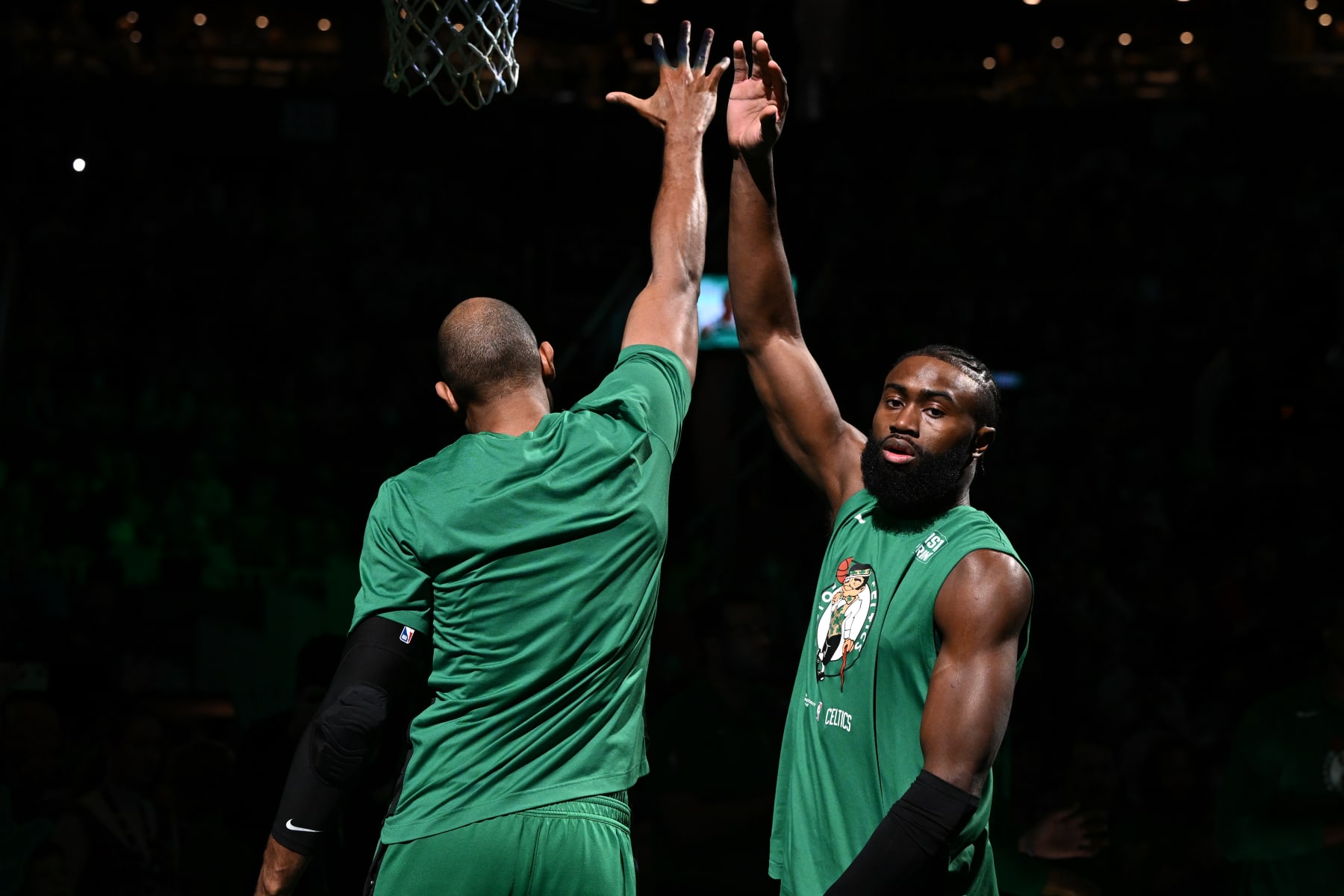 BOSTON, MASSACHUSETTS - DECEMBER 18: Jaylen Brown #7 of the Boston Celtics high-fives Al Horford #42 before a game against the Orlando Magic at the TD Garden on December 18, 2022 in Boston, Massachusetts. NOTE TO USER: User expressly acknowledges and agrees that, by downloading and or using this photograph, User is consenting to the terms and conditions of the Getty Images License Agreement. (Photo by Brian Fluharty/Getty Images)