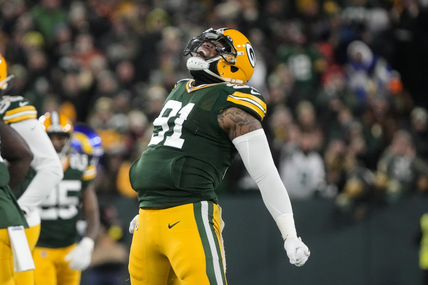 Green Bay Packers linebacker Preston Smith (91) celebrates a sack in the first half of an NFL football game against the Los angles Rams in Green Bay, Wis. Monday, Dec. 19, 2022. (AP Photo/Morry Gash)