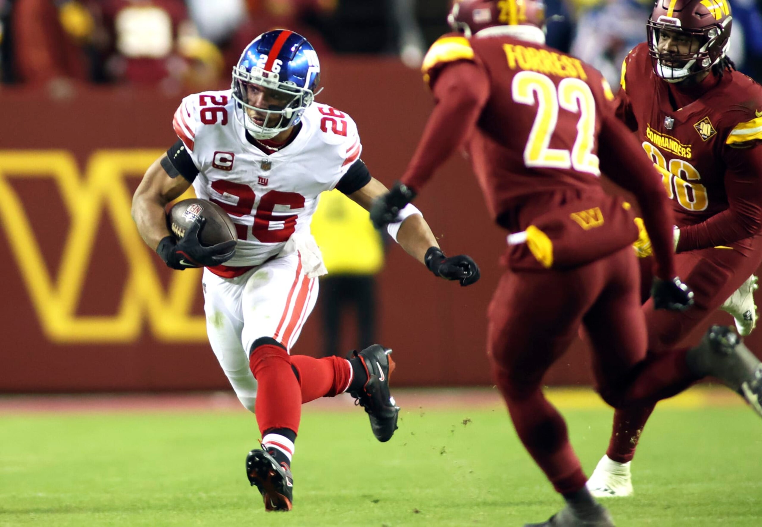 New York Giants running back Saquon Barkley (26) runs during an NFL football game against the Washington Commanders, Sunday, December 12, 2022 in Landover. (AP Photo/Daniel Kucin Jr.)