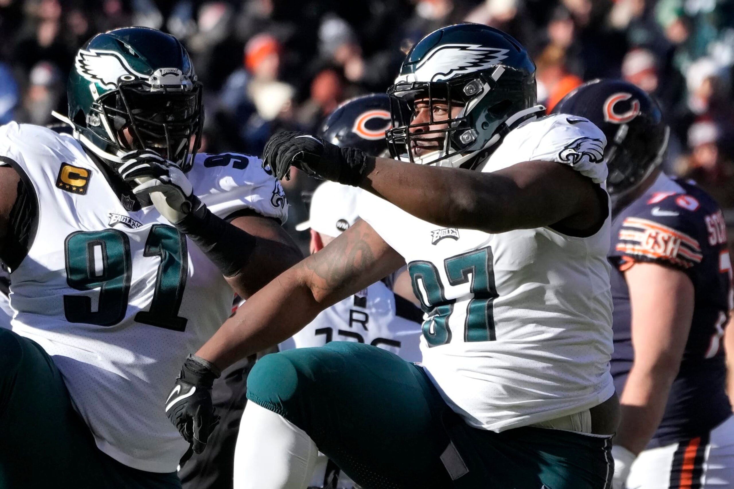Philadelphia Eagles' Fletcher Cox, left, and Javon Hargrave celebrate Hargrave's sack of Chicago Bears quarterback Justin Fields during an NFL football game Sunday, Dec. 18, 2022, in Chicago. (AP Photo/Charles Rex Arbogast)