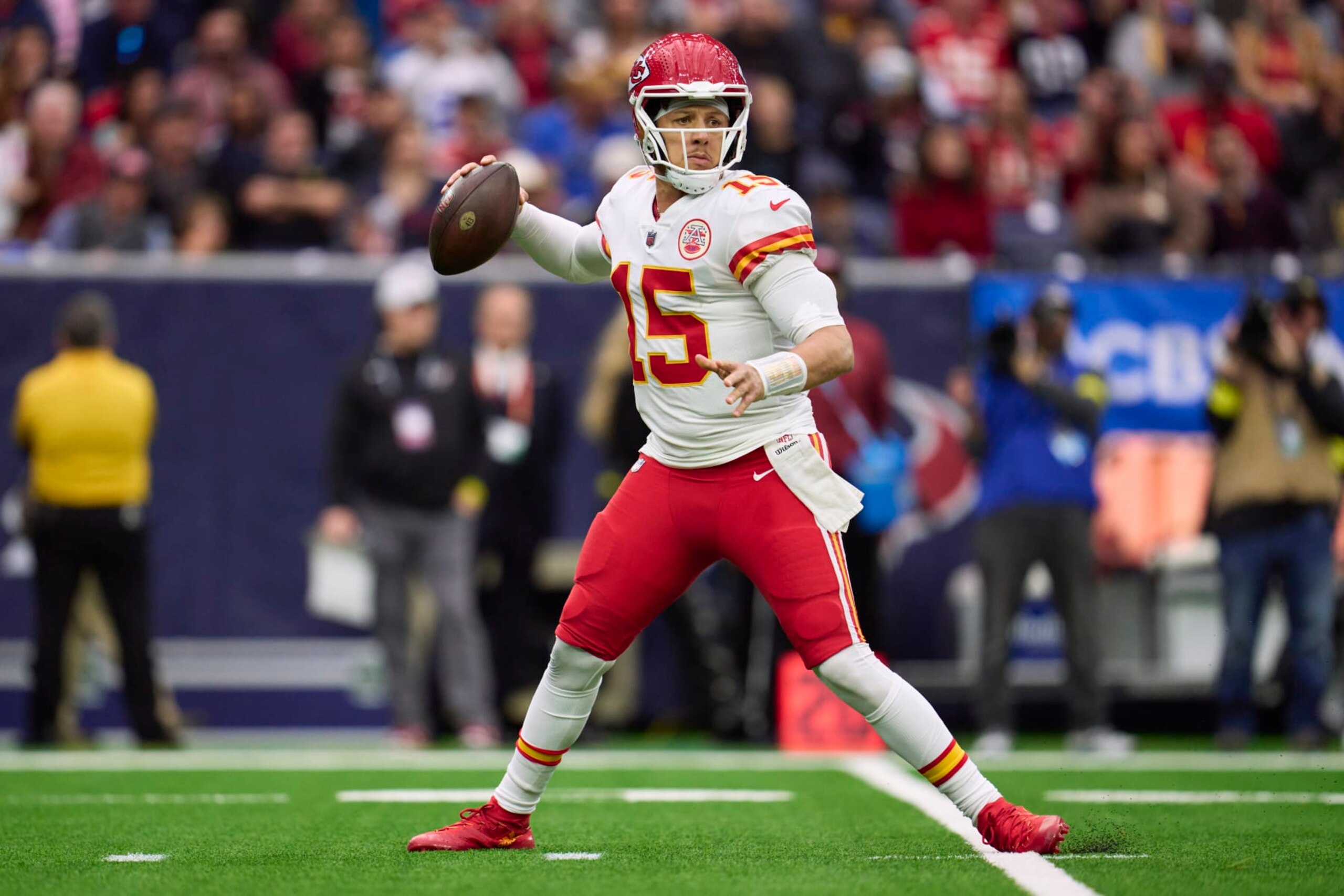 HOUSTON, TX - DECEMBER 18: Patrick Mahomes #15 of the Kansas City Chiefs drops back to pass against the Houston Texans during the first half at NRG Stadium on December 18, 2022 in Houston, Texas. (Photo by Cooper Neill/Getty Images)