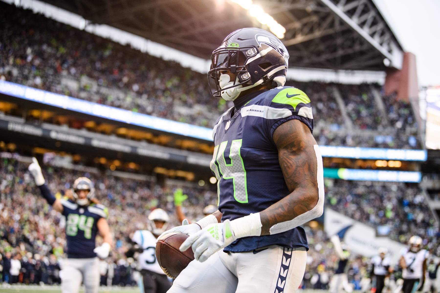 SEATTLE, WASHINGTON - DECEMBER 11: DK Metcalf #14 of the Seattle Seahawks catches a pass for a touchdown during the second quarter of the game against the Carolina Panthers at Lumen Field on December 11, 2022 in Seattle, Washington. (Photo by Jane Gershovich/Getty Images)