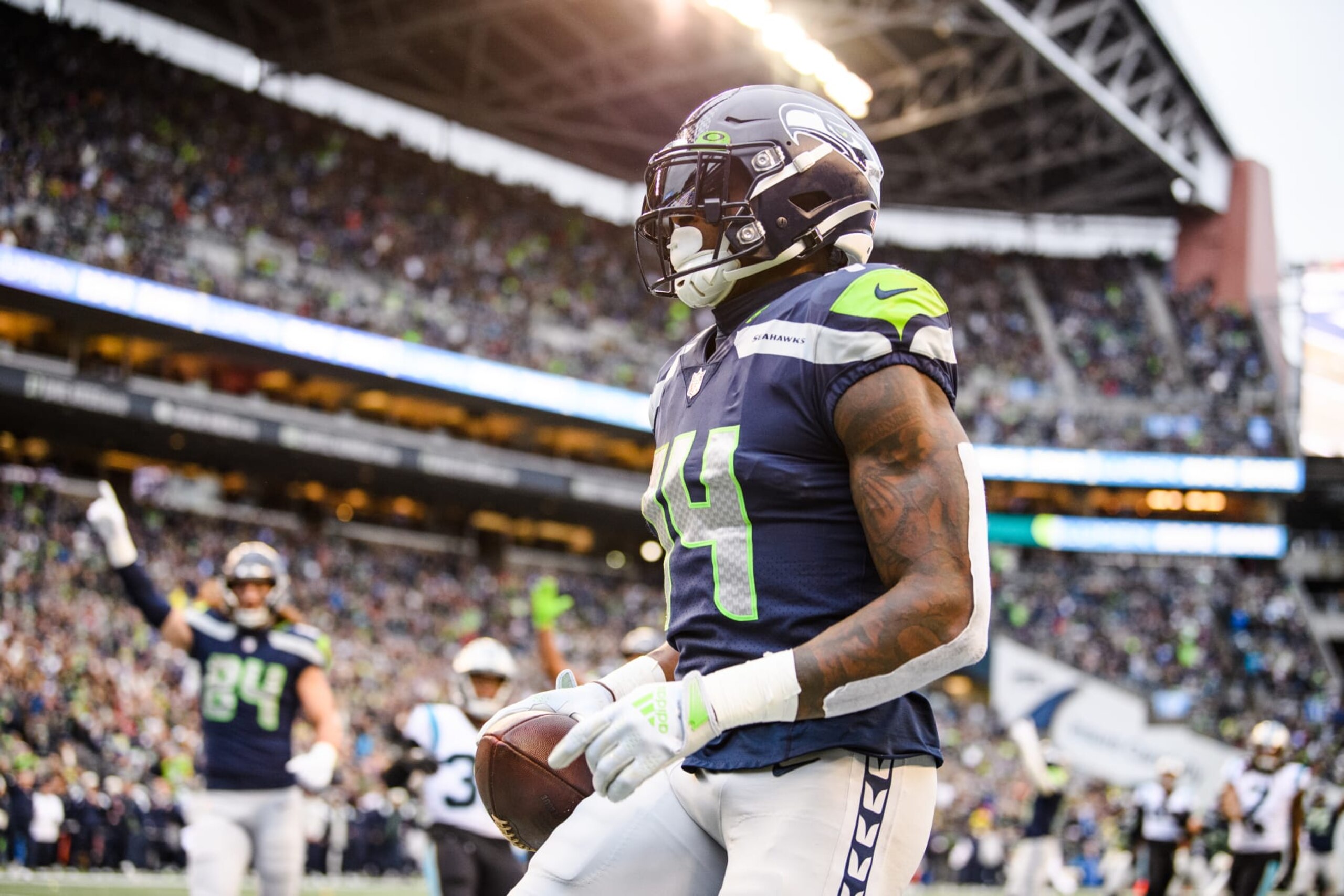 SEATTLE, WASHINGTON - DECEMBER 11: DK Metcalf #14 of the Seattle Seahawks catches a pass for a touchdown during the second quarter of the game against the Carolina Panthers at Lumen Field on December 11, 2022 in Seattle, Washington. (Photo by Jane Gershovich/Getty Images)