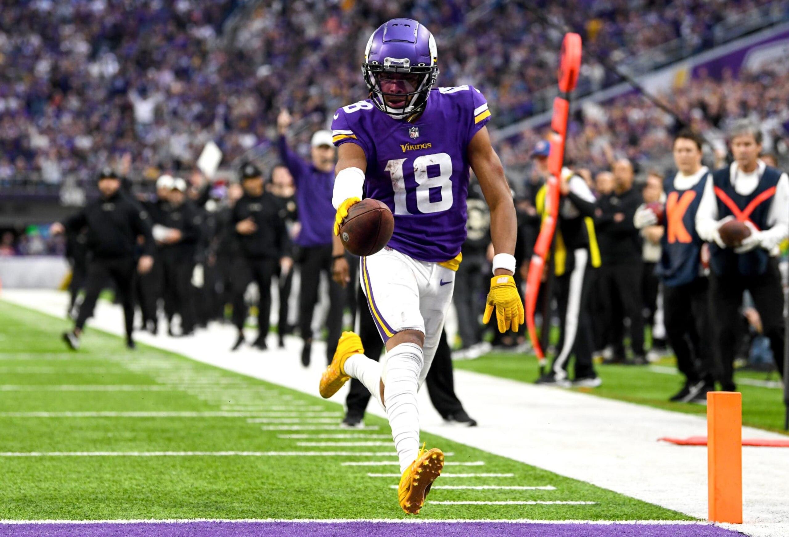 MINNEAPOLIS, MINNESOTA - DECEMBER 17: Justin Jefferson #18 of the Minnesota Vikings scores a touchdown against the Indianapolis Colts during the fourth quarter of the game at U.S. Bank Stadium on December 17, 2022 in Minneapolis, Minnesota. (Photo by Stephen Maturen/Getty Images)