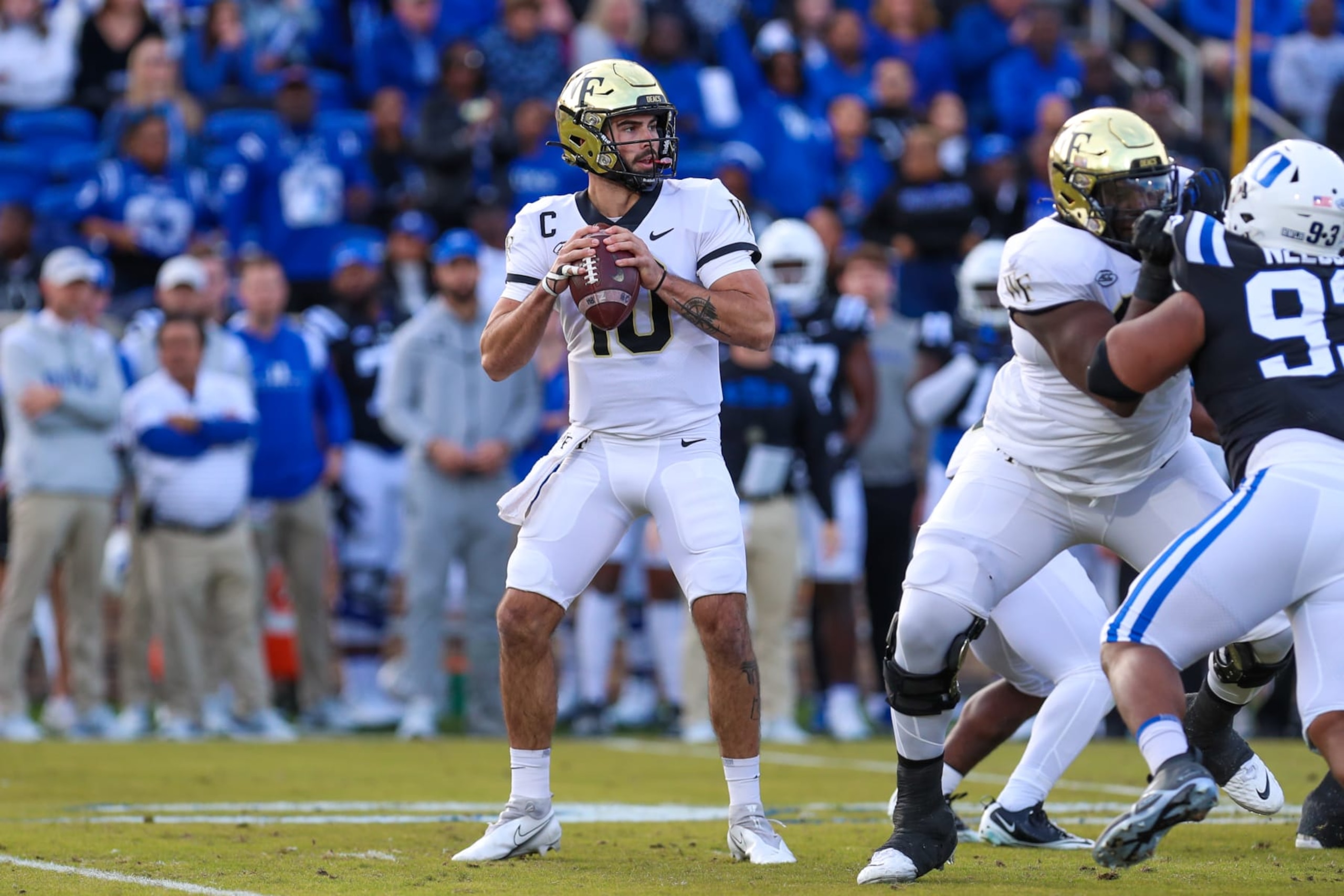 DURHAM, NC - NOVEMBER 26: Sam Hartman (10) of the Wake Forest Demon Deacons looks to pass the ball during a football game between the Duke Blue Devils and the Wake Forest Demon Deacons on Nov 26, 2022 at Wallace Wade Stadium in Durham, NC. (Photo by David Jensen/Icon Sportswire via Getty Images)