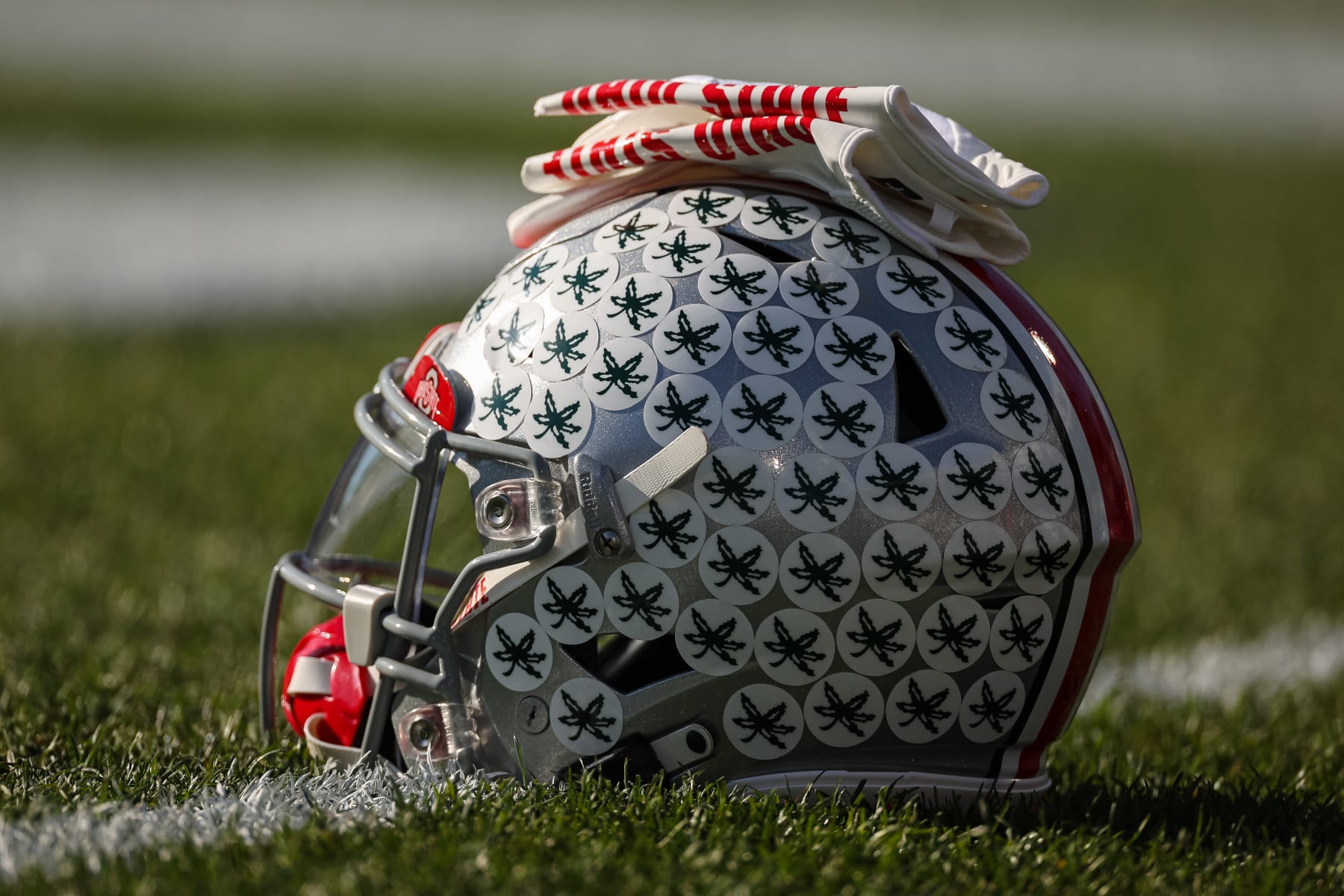 STATE COLLEGE, PA - OCTOBER 29: A Penn State Nittany Lions helmet and gloves are seen on the field before the game against the Penn State Nittany Lions at Beaver Stadium on October 29, 2022 in State College, Pennsylvania. (Photo by Scott Taetsch/Getty Images)